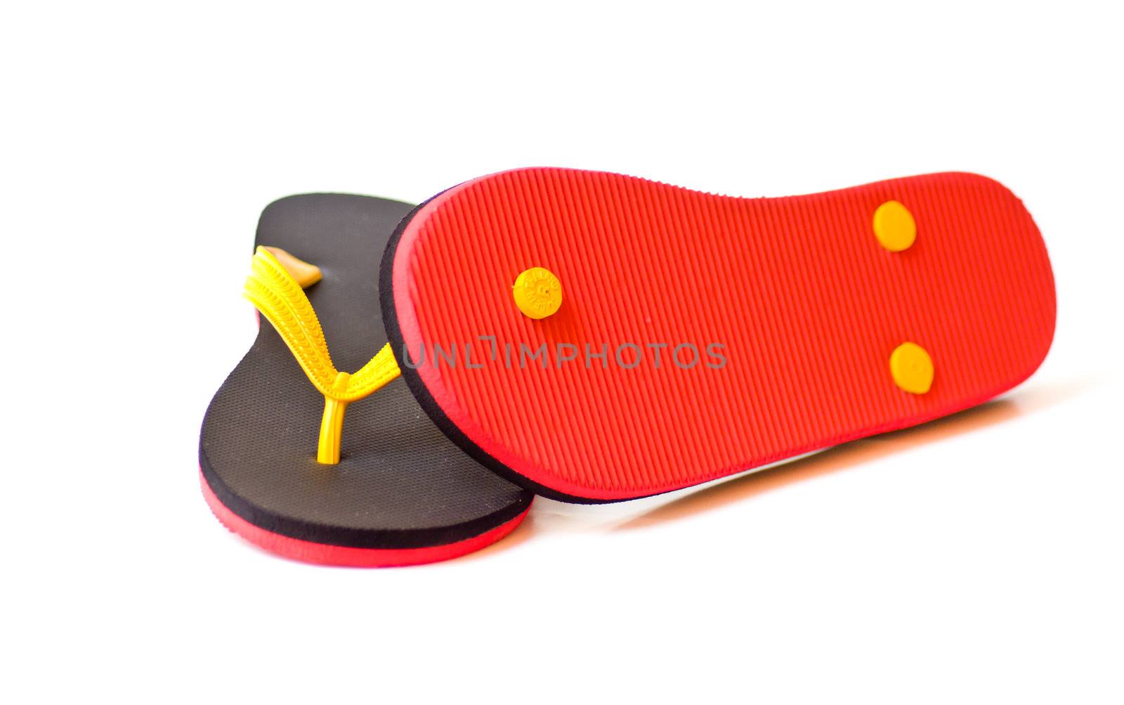 black and red slipper on white background