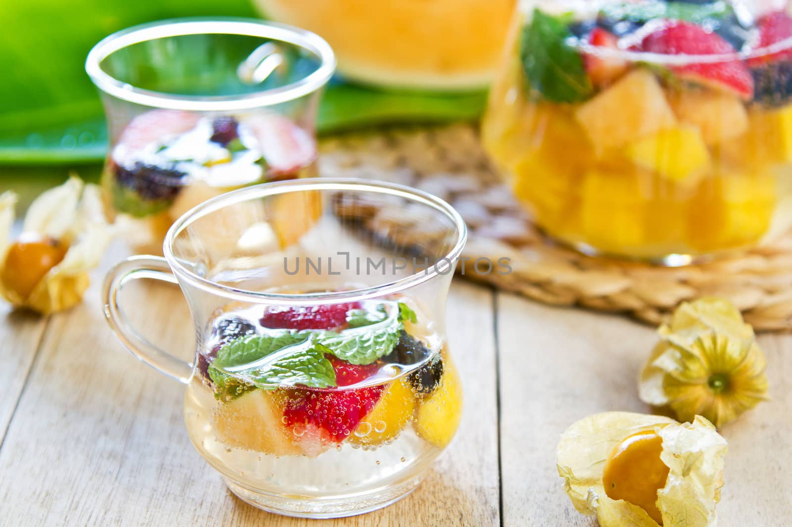 Varieties of fruits with mint and lemonade