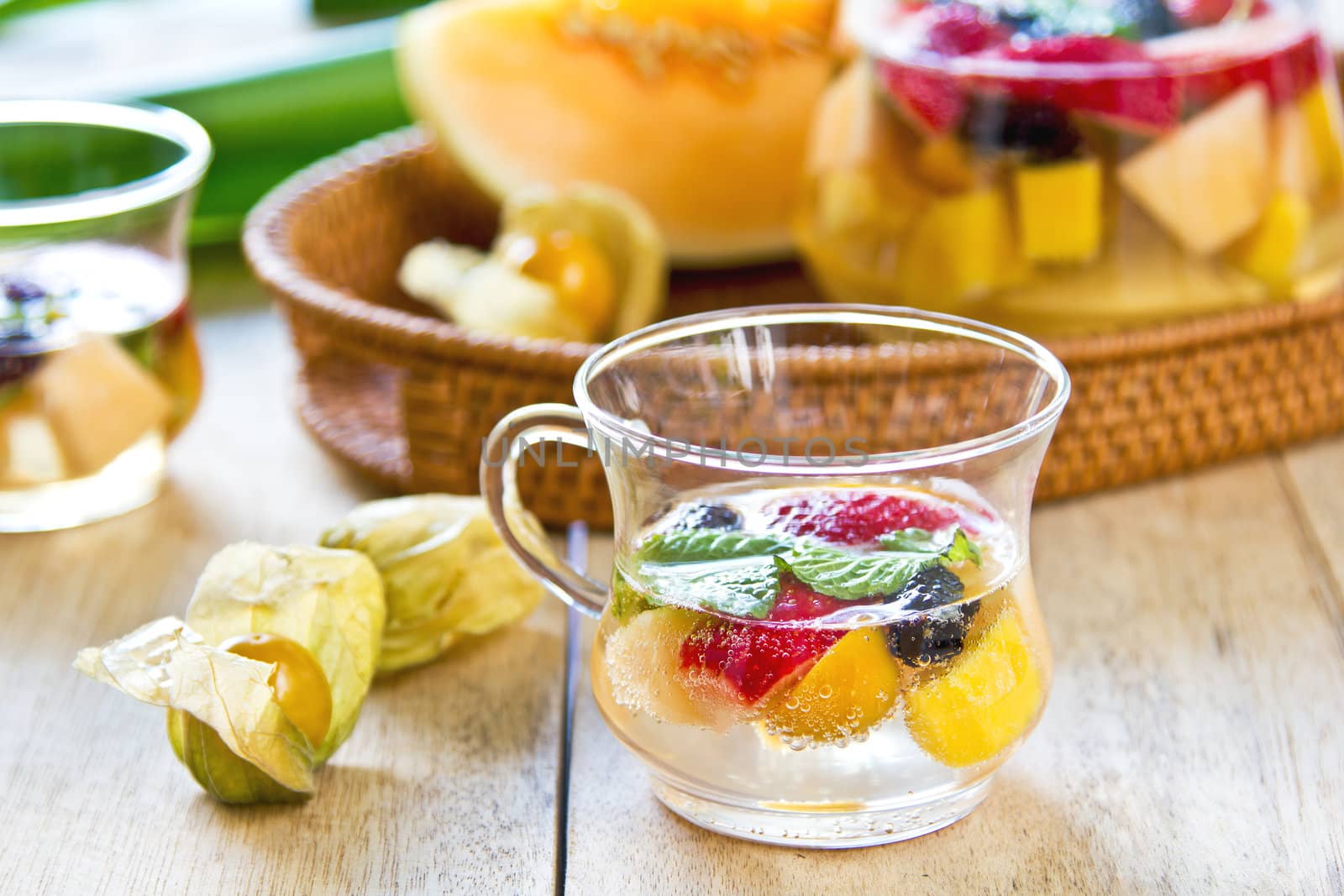 Varieties of fruits with mint and lemonade