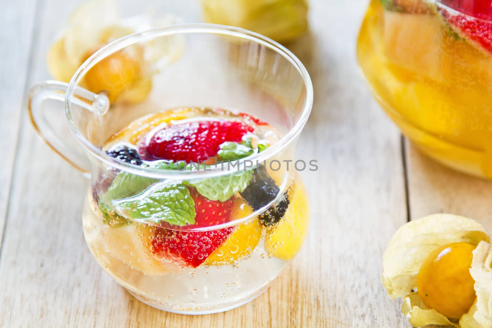 Varieties of fruits with mint and lemonade