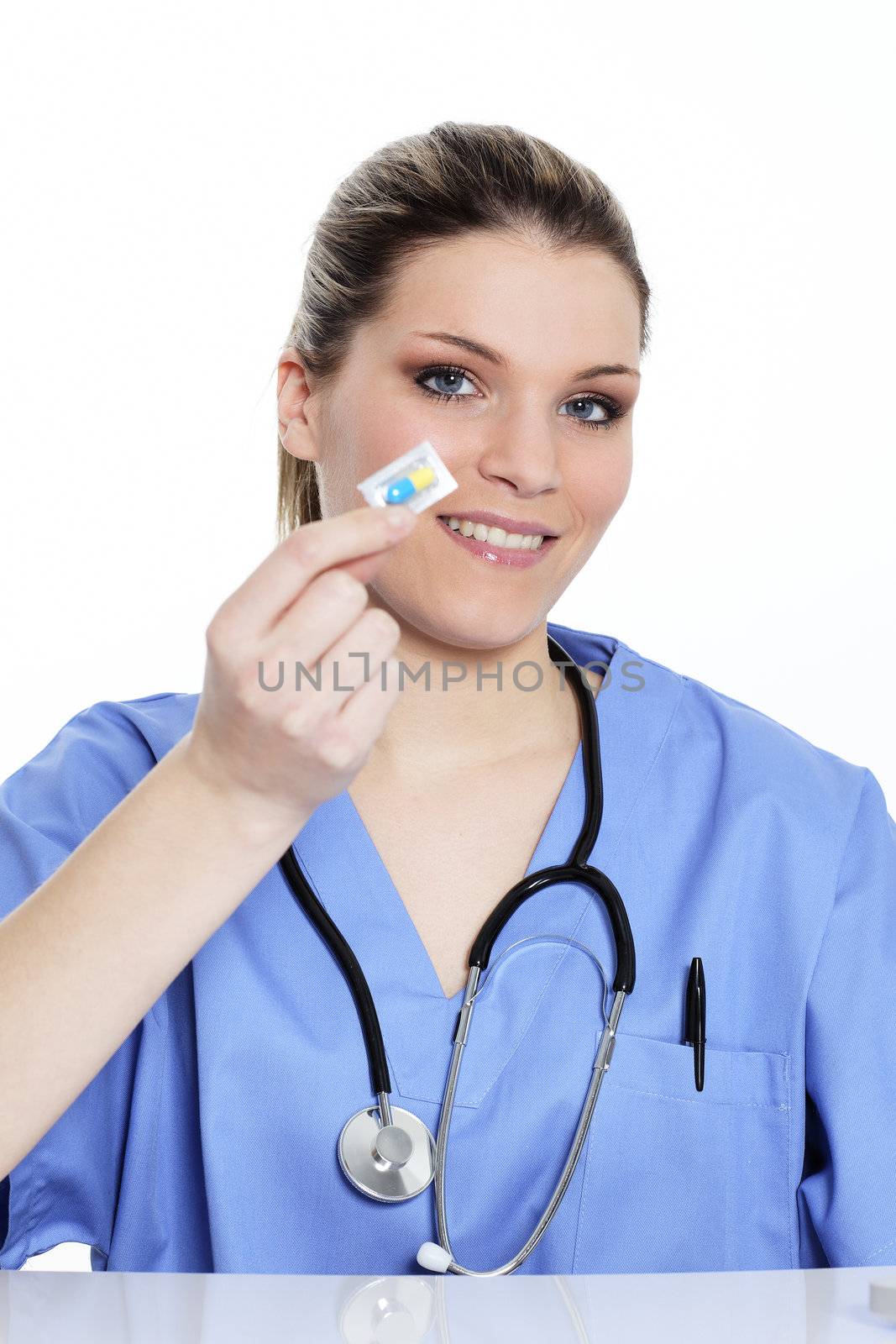 woman doctor holding a pill in hospital