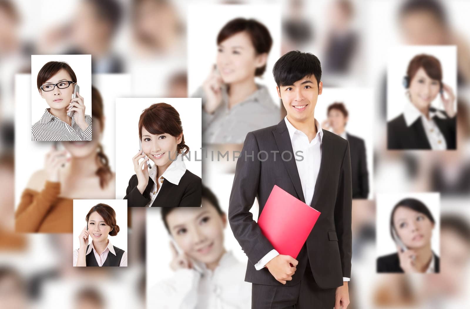 Young businessman of Asian stand in front of business portrait wall.