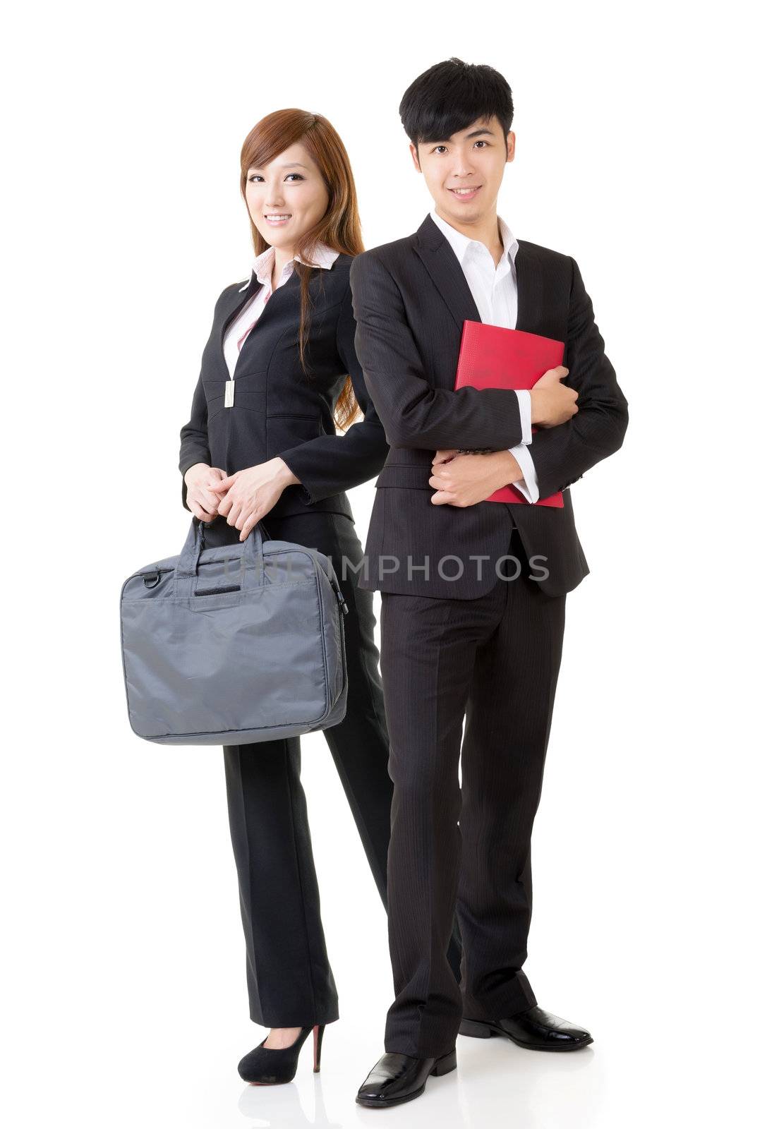 Young business man and woman, full length portrait isolated on white background.