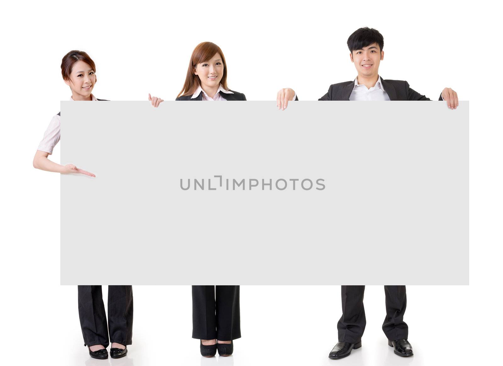 Young business people hold blank board with copyspace, full length portrait isolated on white background.