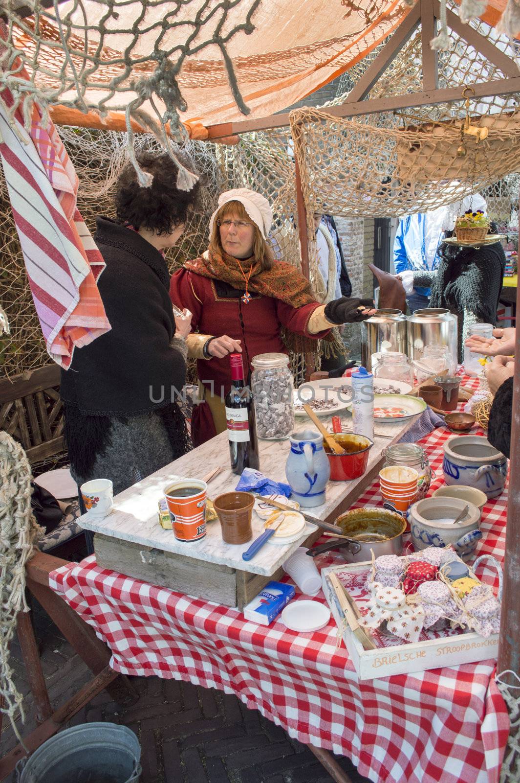 BRIELLE,HOLLAND APRIL 01:Woman selling candy on April 01, 2013 in Brielle,Holland.This is the party of the point in the uprising of Low Countries against Spain in the 80 Years' War