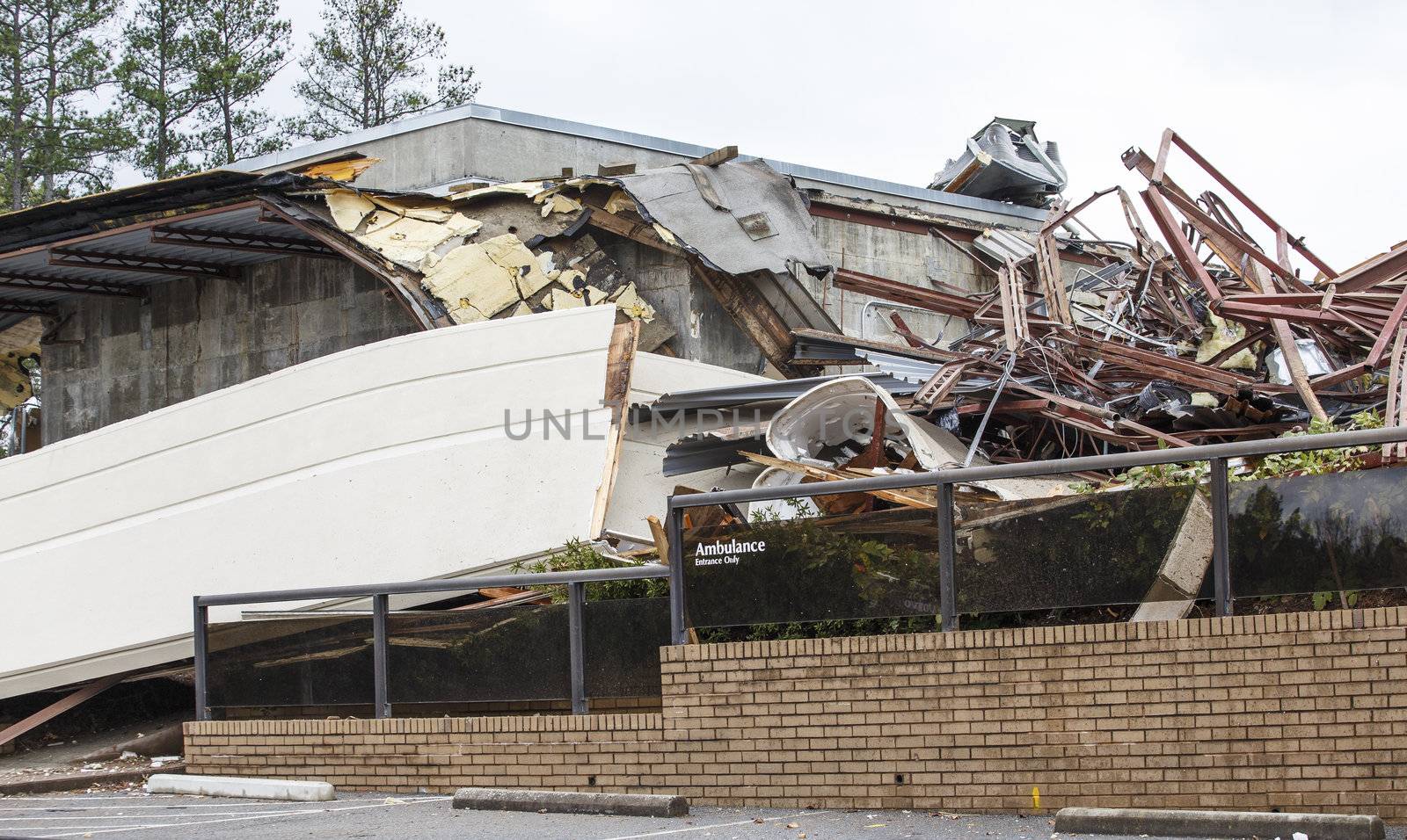 An emergency room building after demolition with Ambulance entrance sign intact