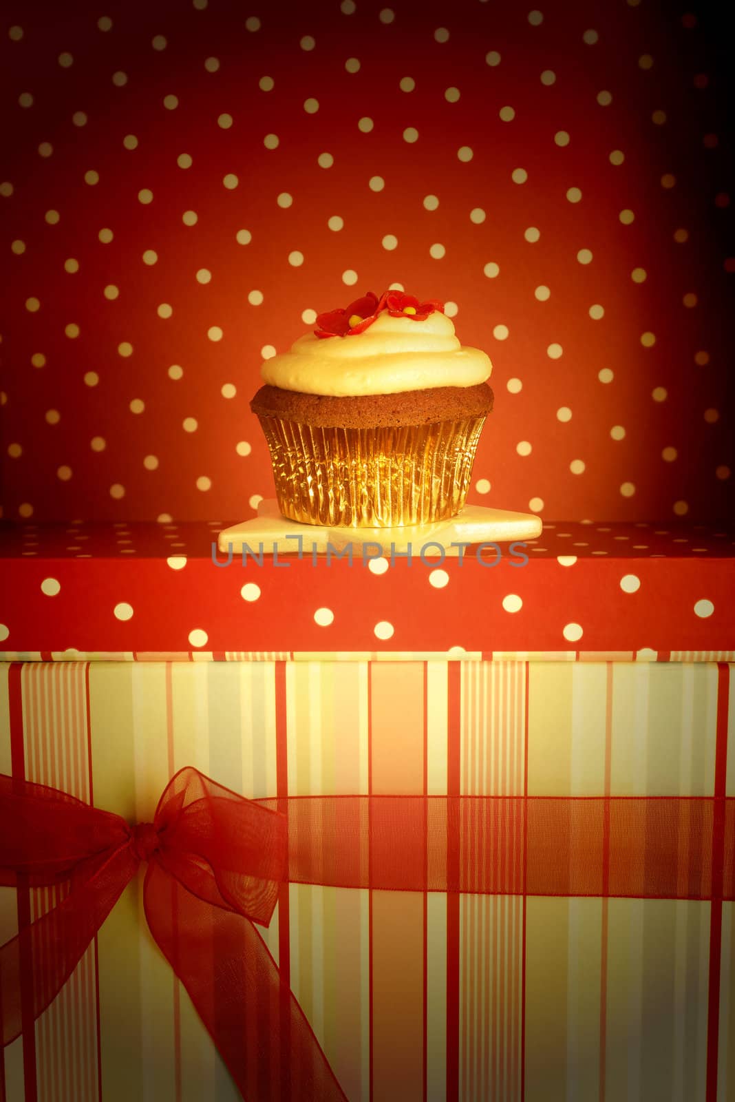 chocolate cupcake decorated with flowers and gift card