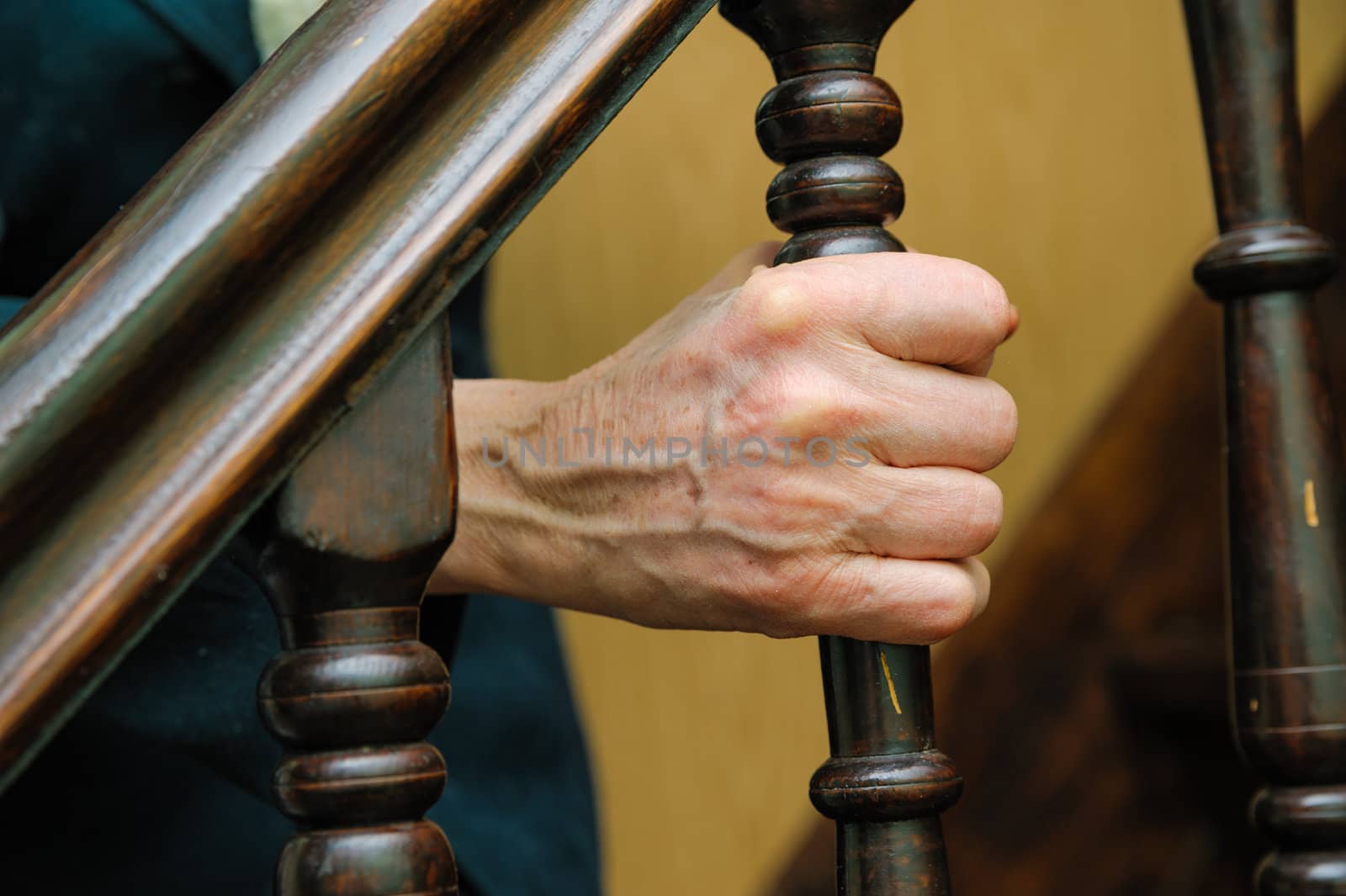 old woman wrinkled hands hold the handrail by docer2000