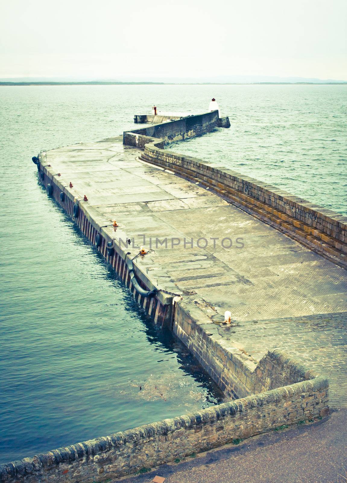 Concrete jetty at Burghead harbour in Scotland