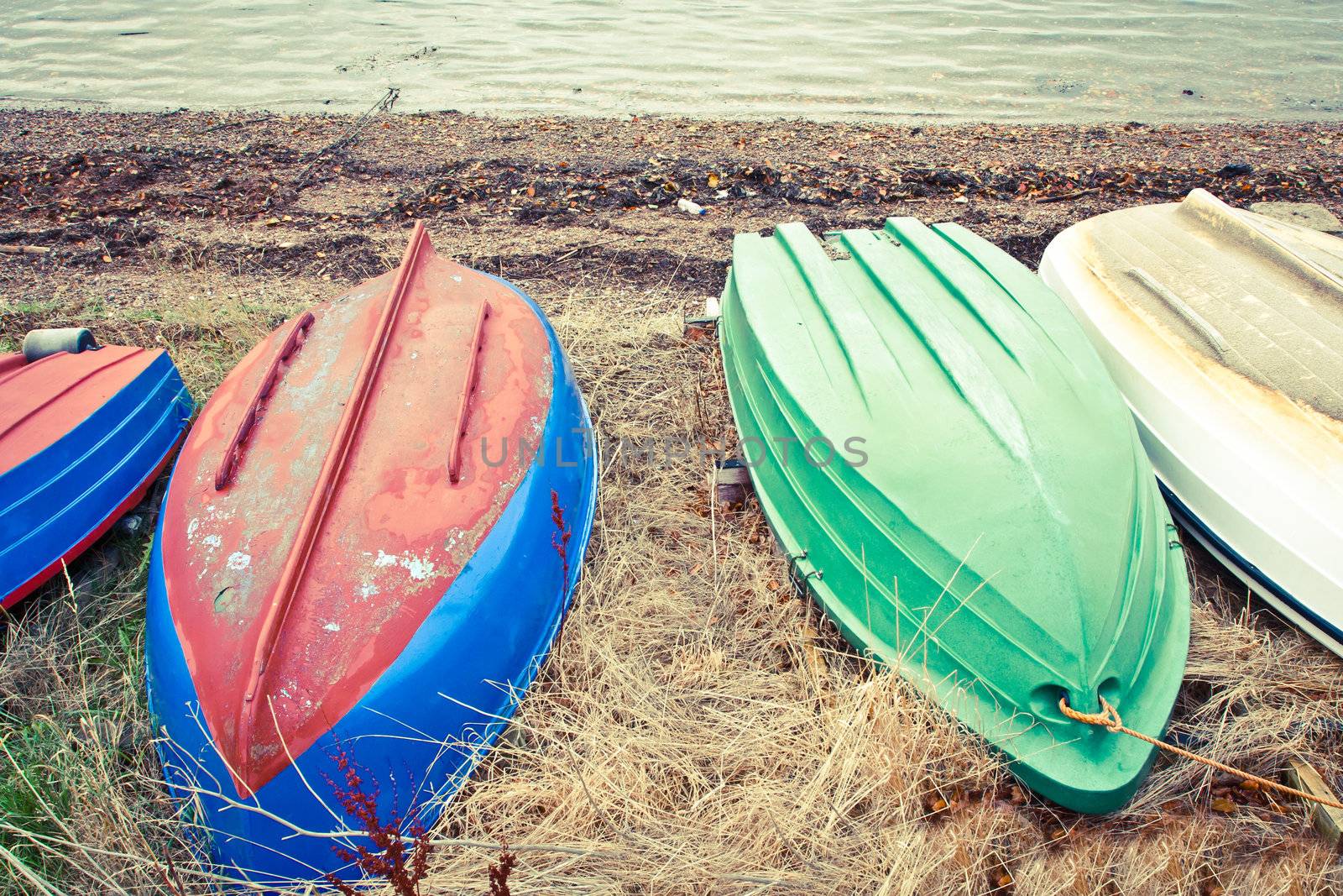 Upturned rowing boats on a pebble beach