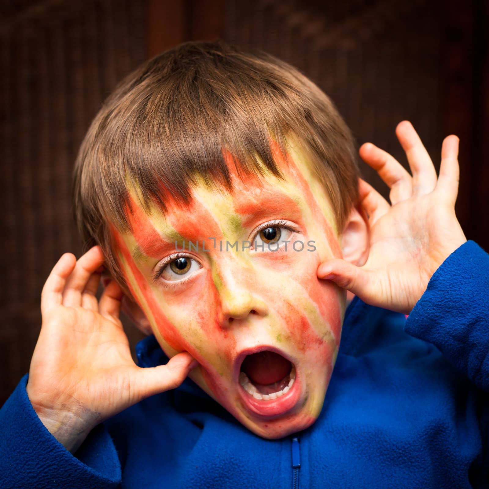 A five year old boy with face paint on