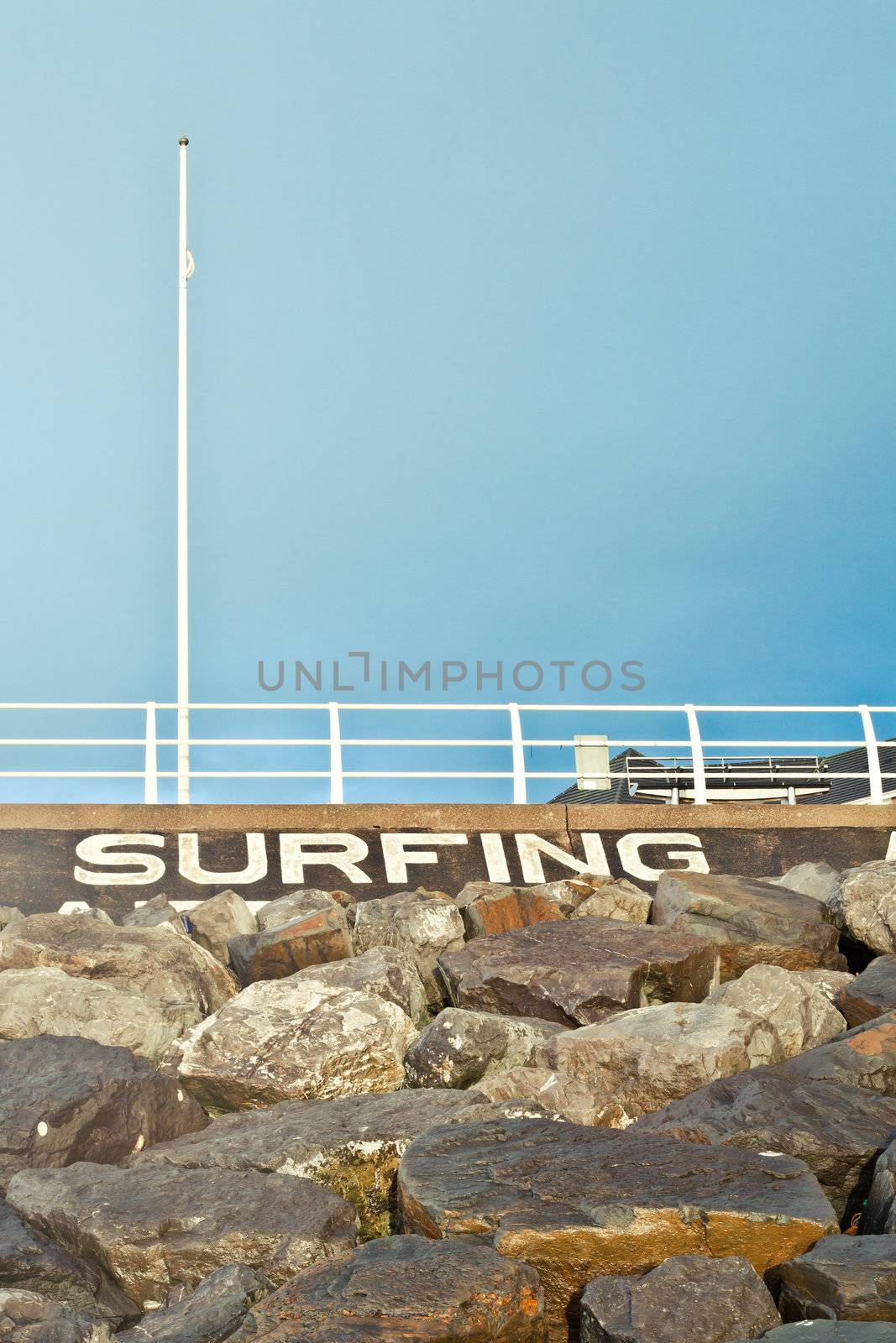 Sign indicating surfing area on Aberafan Beach in Wales