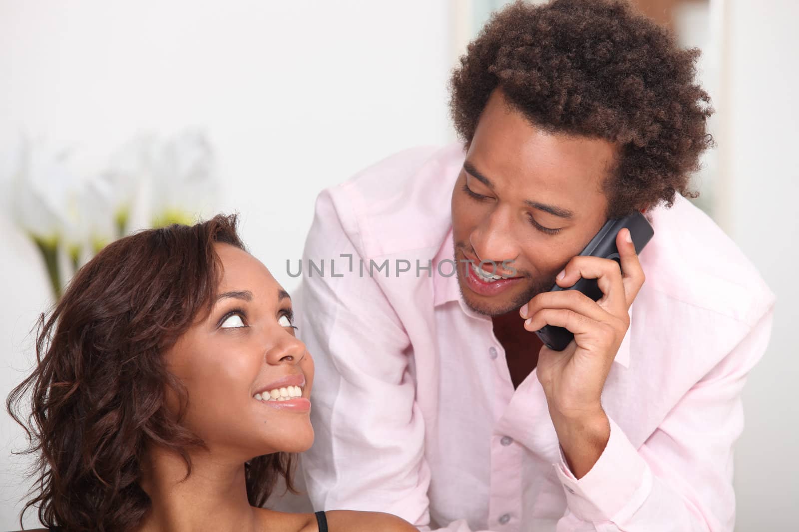 Couple making telephone call