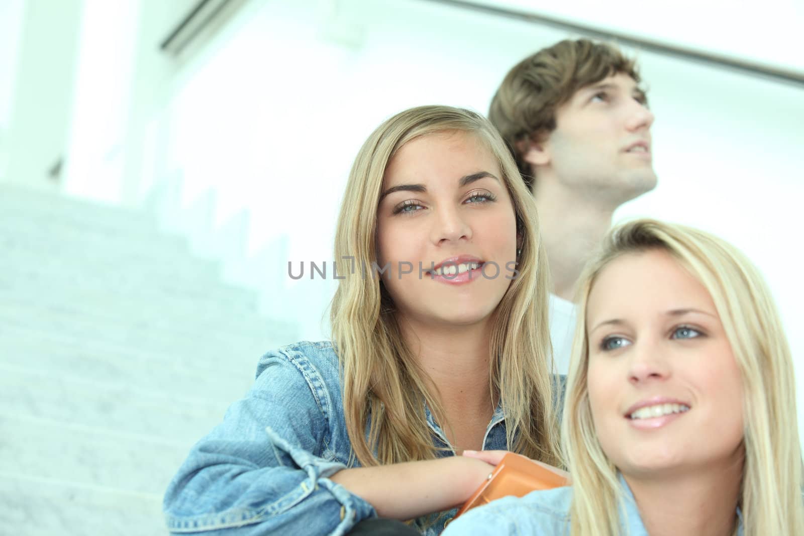 Students sitting on some steps by phovoir