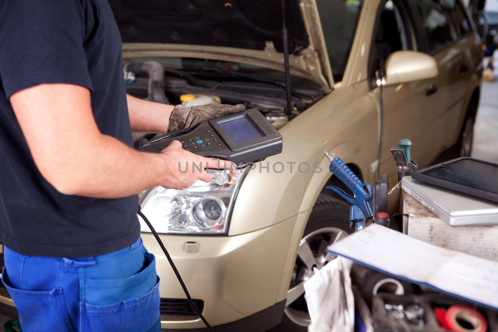 Mechanic with Diagnostic Equipment by leaf