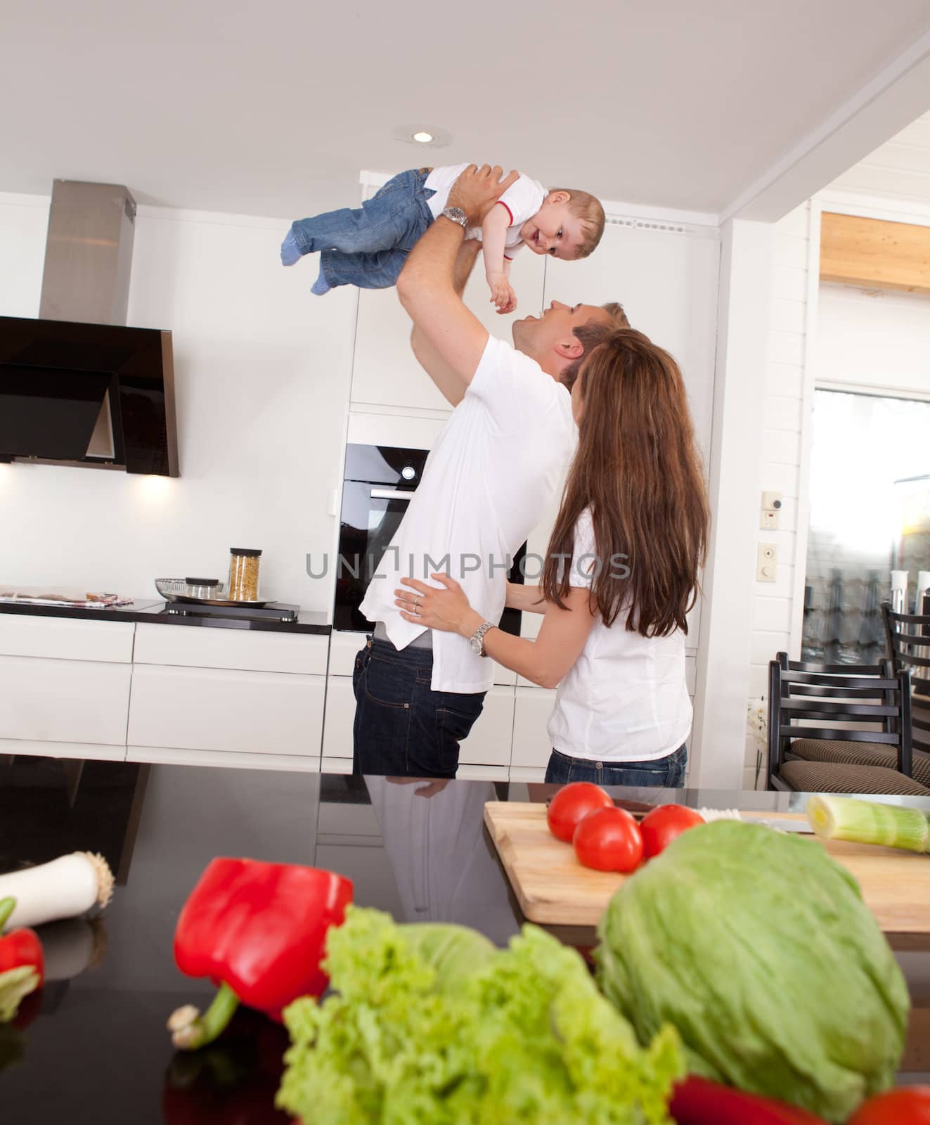 Playful Family in Kitchen by leaf