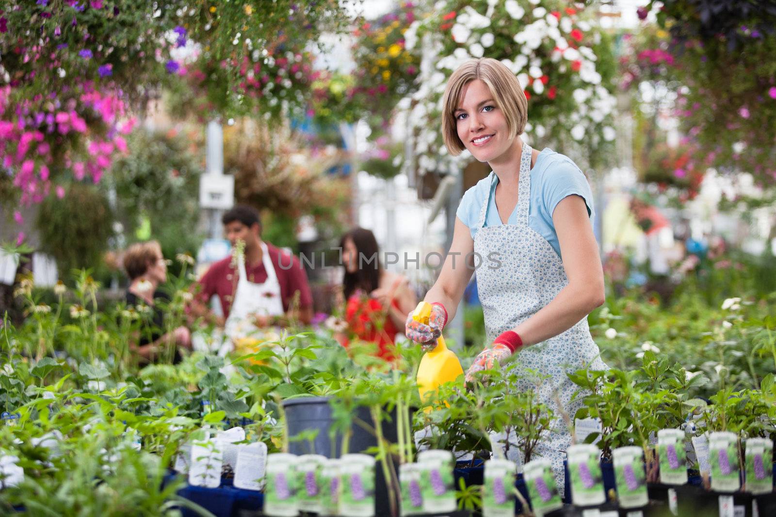 Woman Working in Greenhouse by leaf