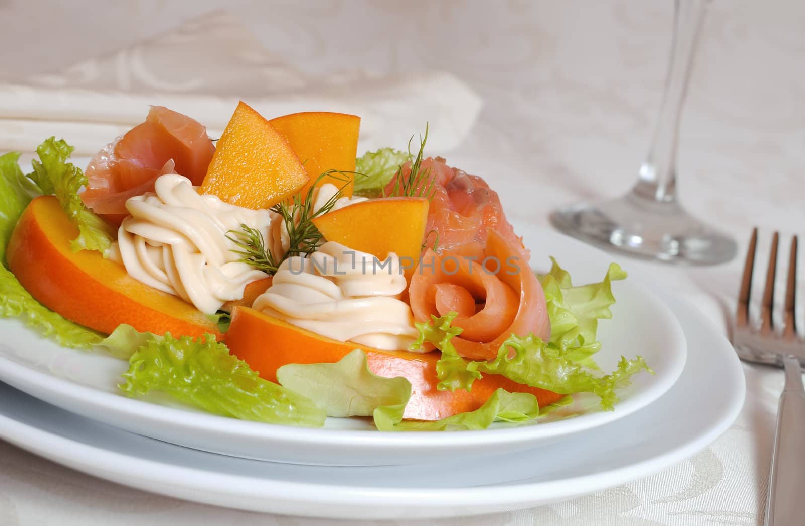 Salmon salad with persimmon and cream cheese closeup