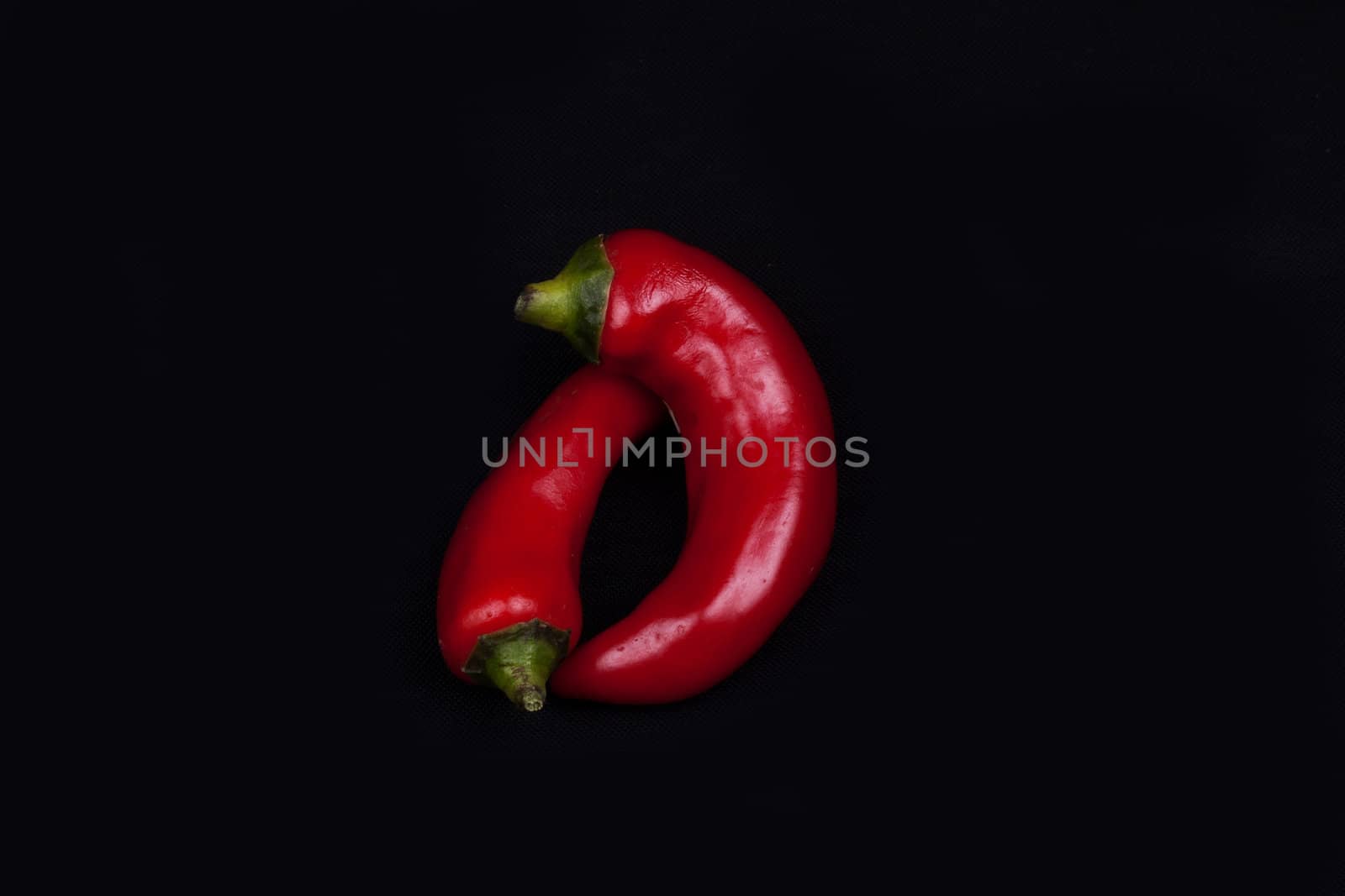 Red hot chilli peppers  isolated on black.