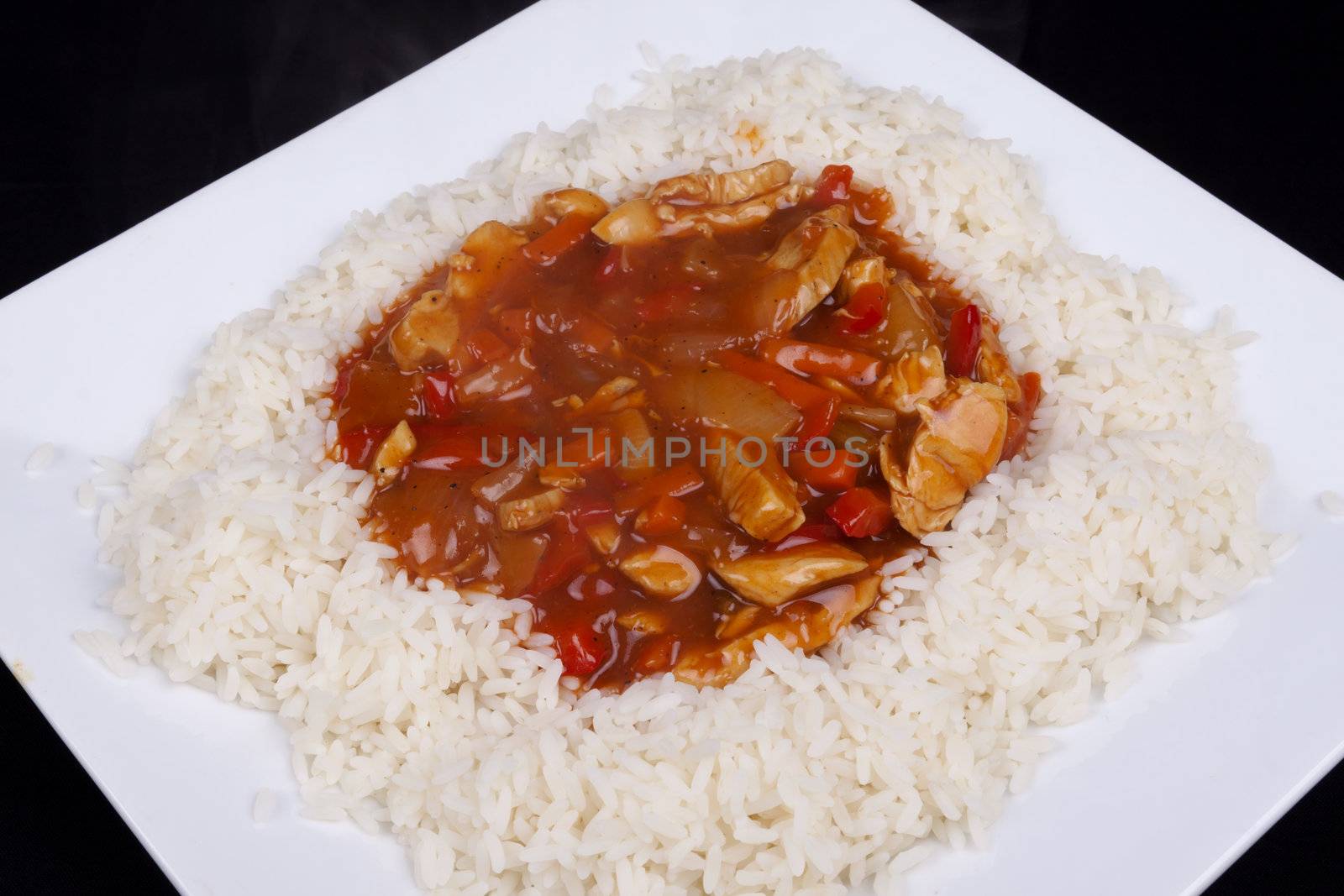 Closeup photo of chinese sweet and sour chicken with rice.