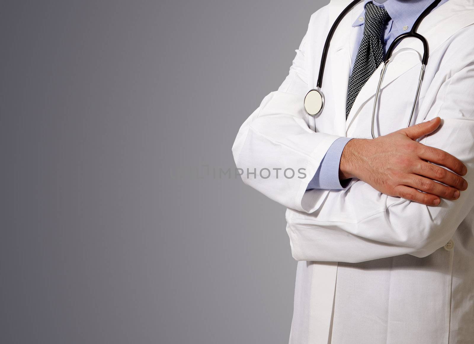 Doctor with a stethoscope at neck, grey background