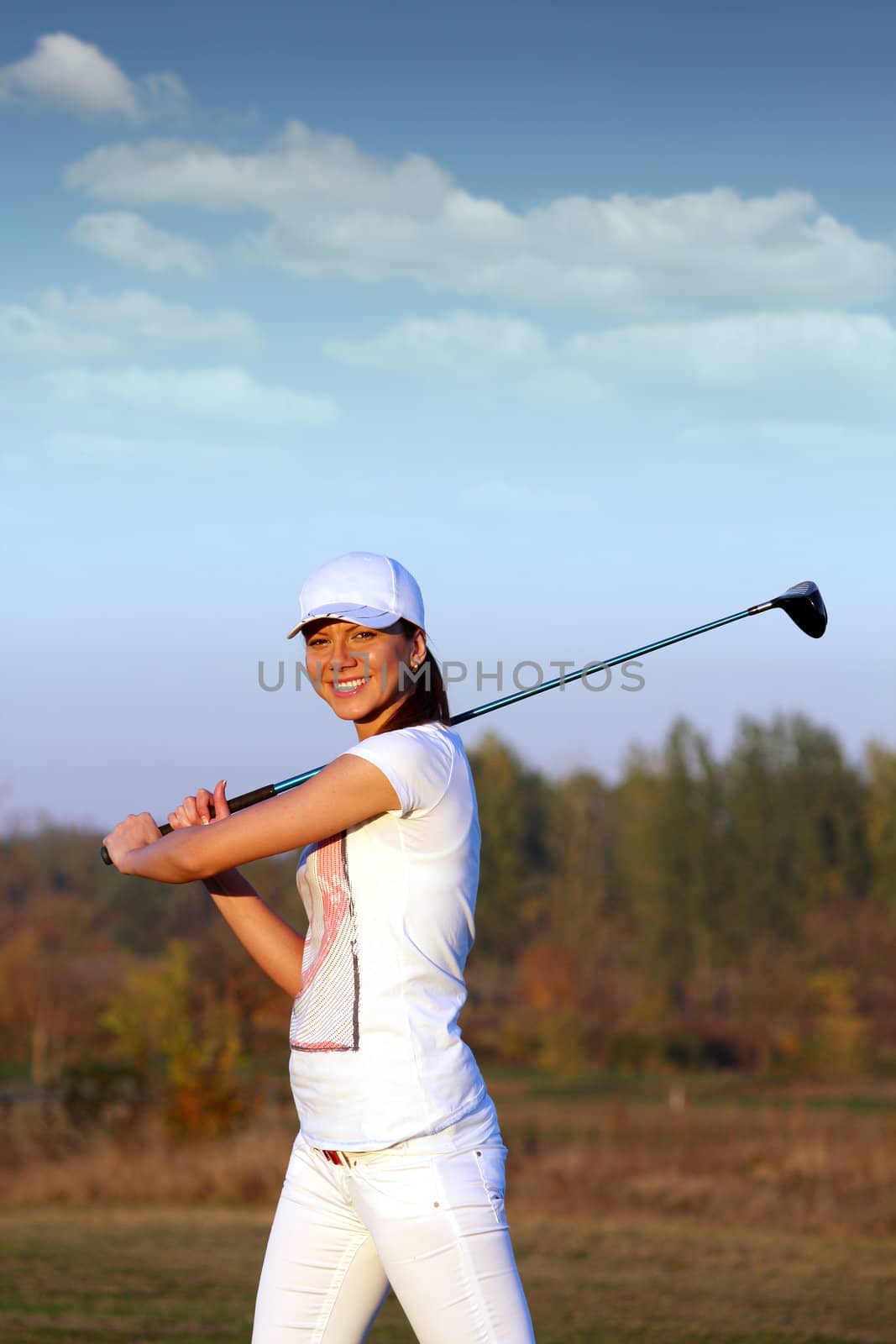 beautiful girl golf player on field by goce