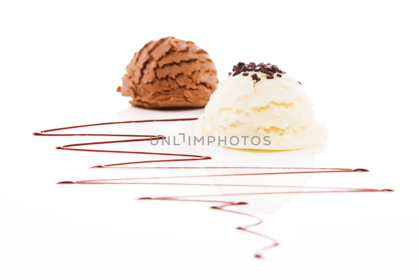 vanilla flavor ice cream with chocolate crumbles in front of chocolate ice cream  by RobStark