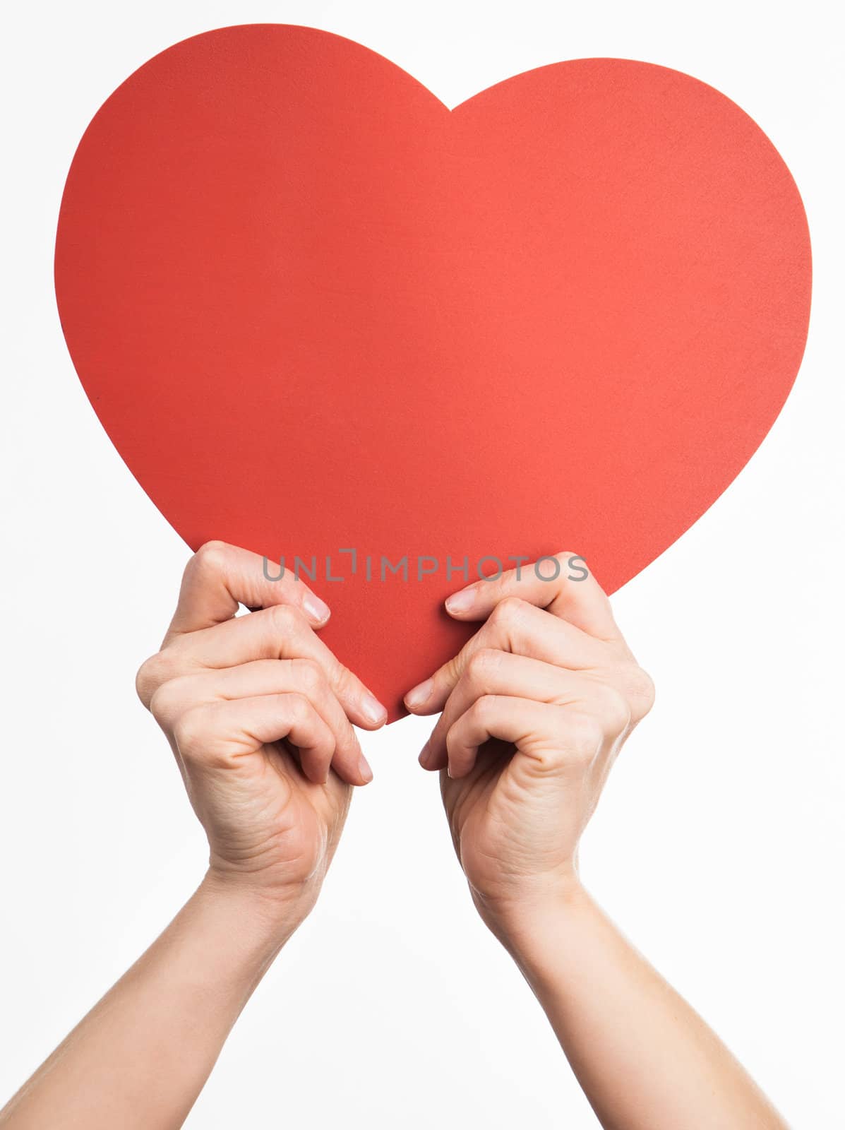 Hands holding heart shape by Izaphoto