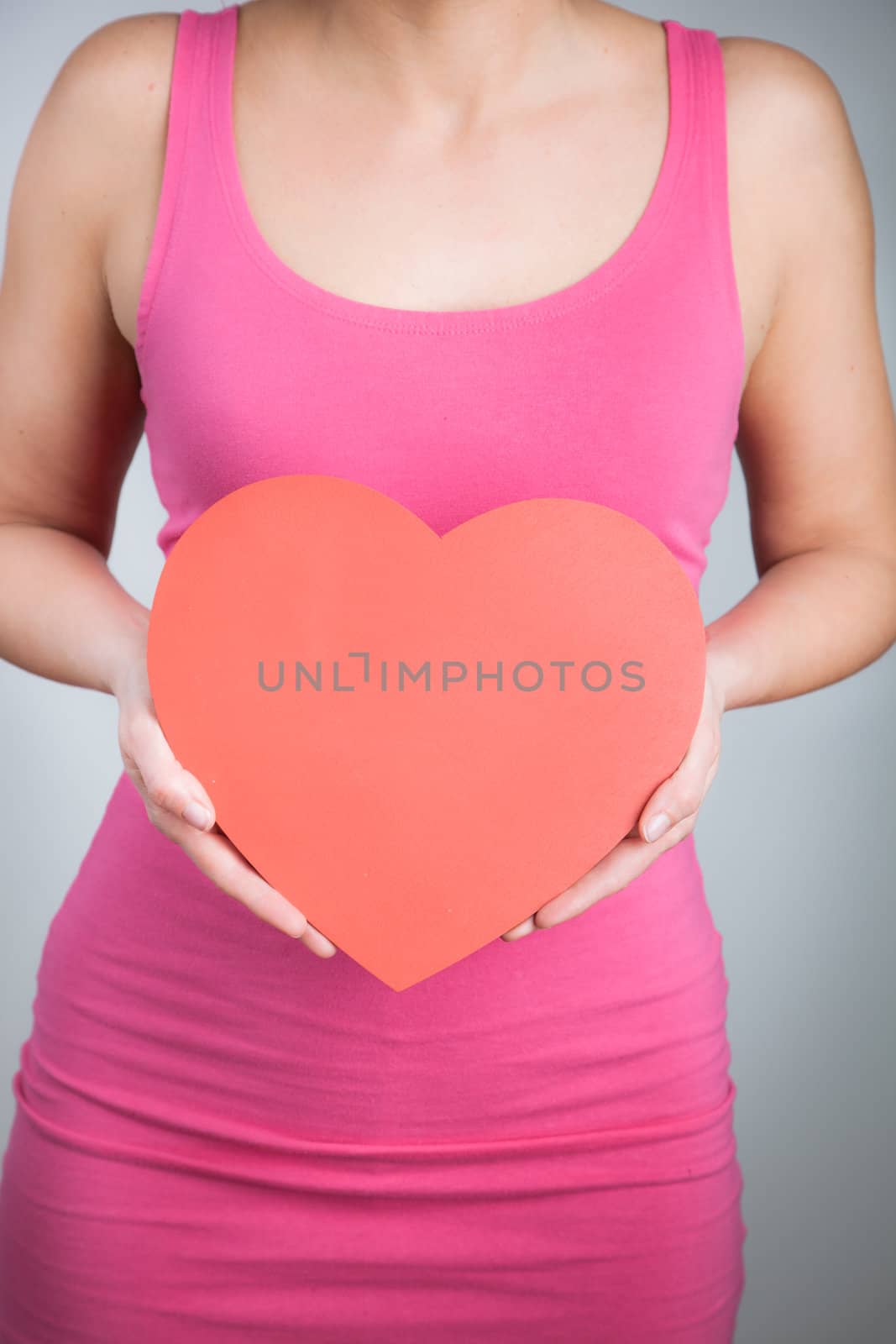 Hands holding heart shape by Izaphoto