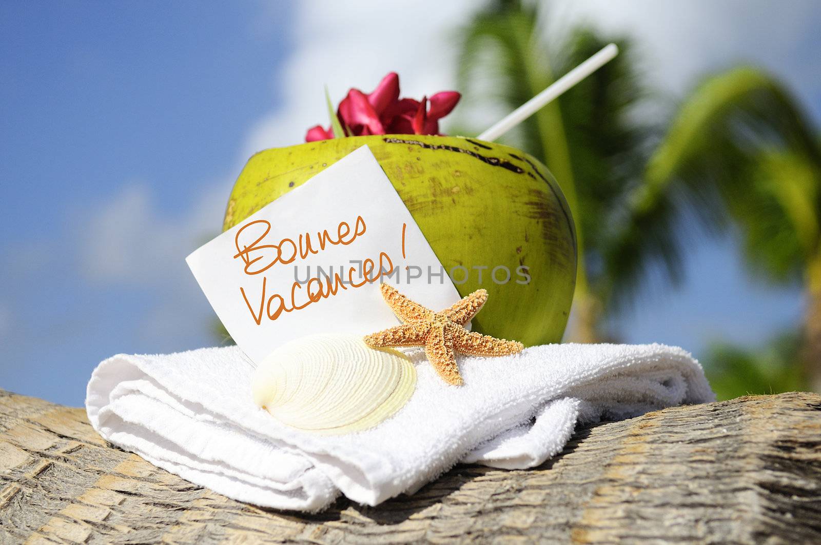 Coconut cocktail starfish tropical Caribbean beach refreshment and towel