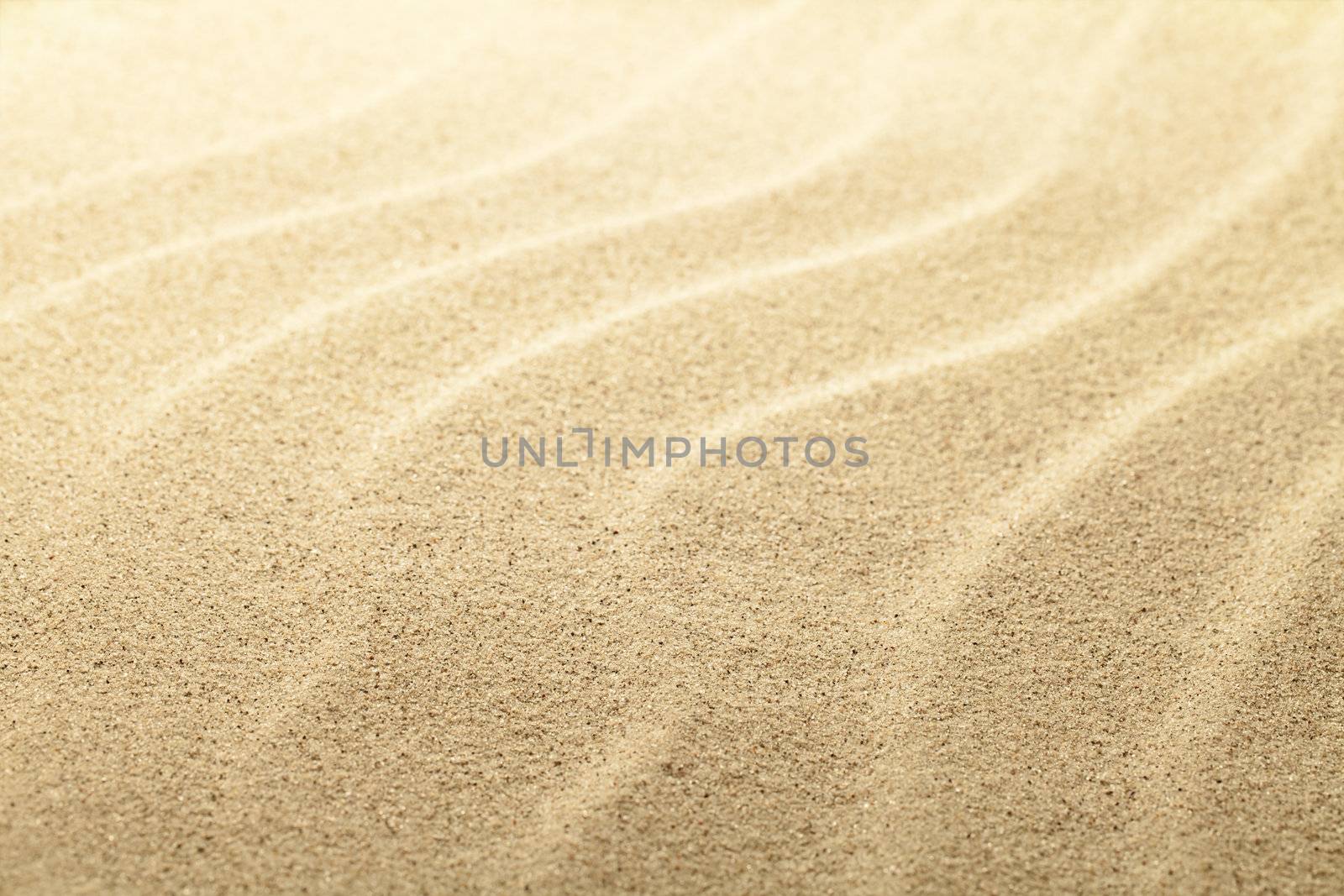 Beach sand background, sandy waves close up view