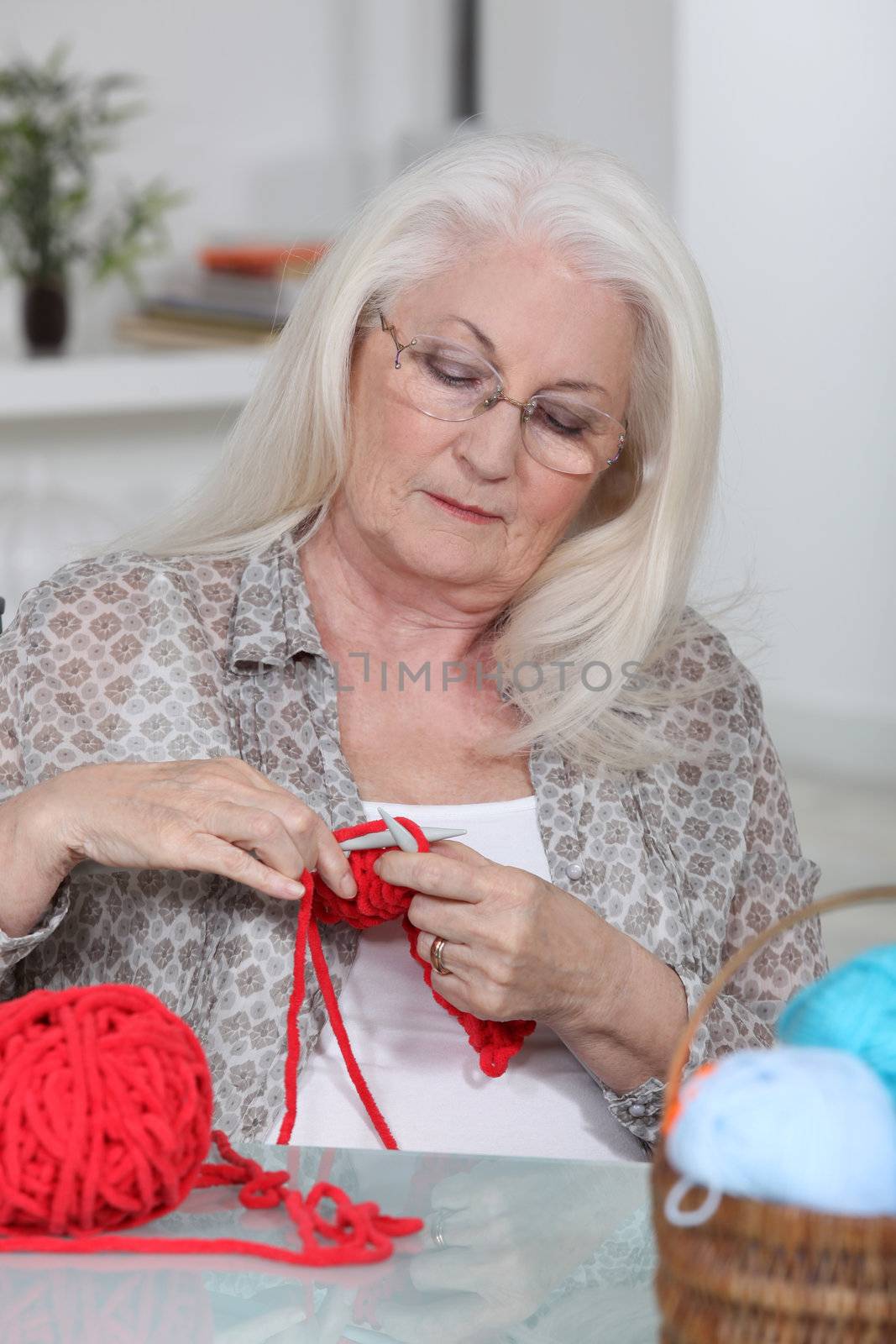 Older woman knitting