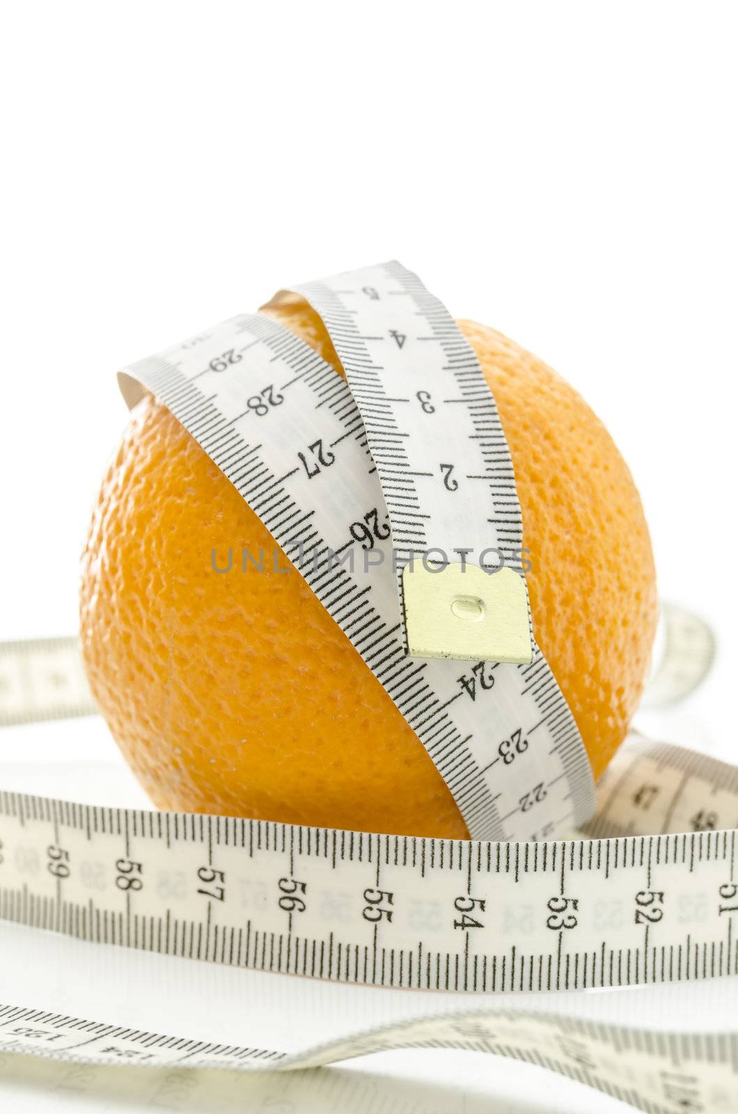 Fresh orange with white measuring tape wrapped around it. Over white background.