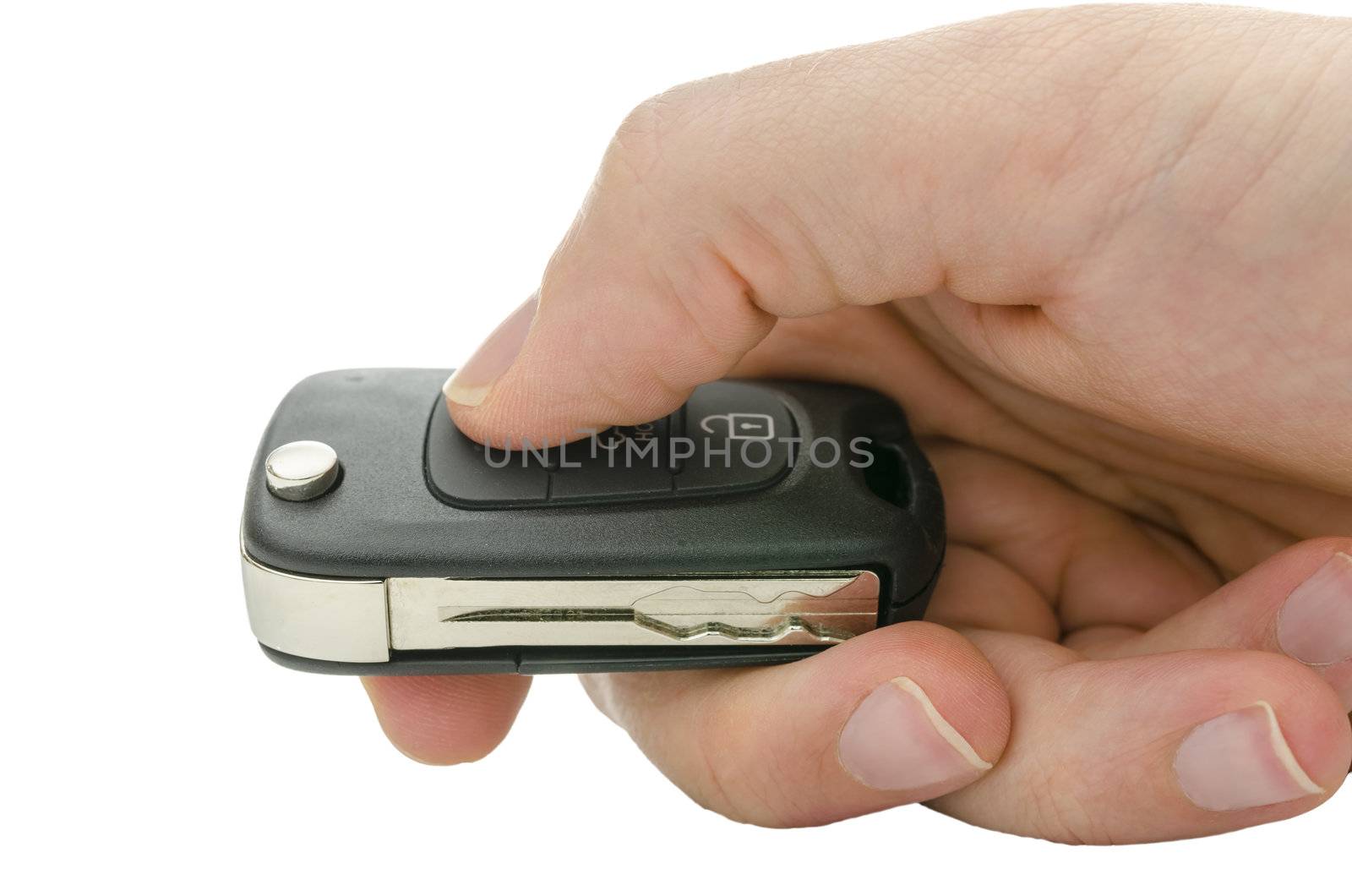 Closeup of male hand holding car key. isolated over white background.