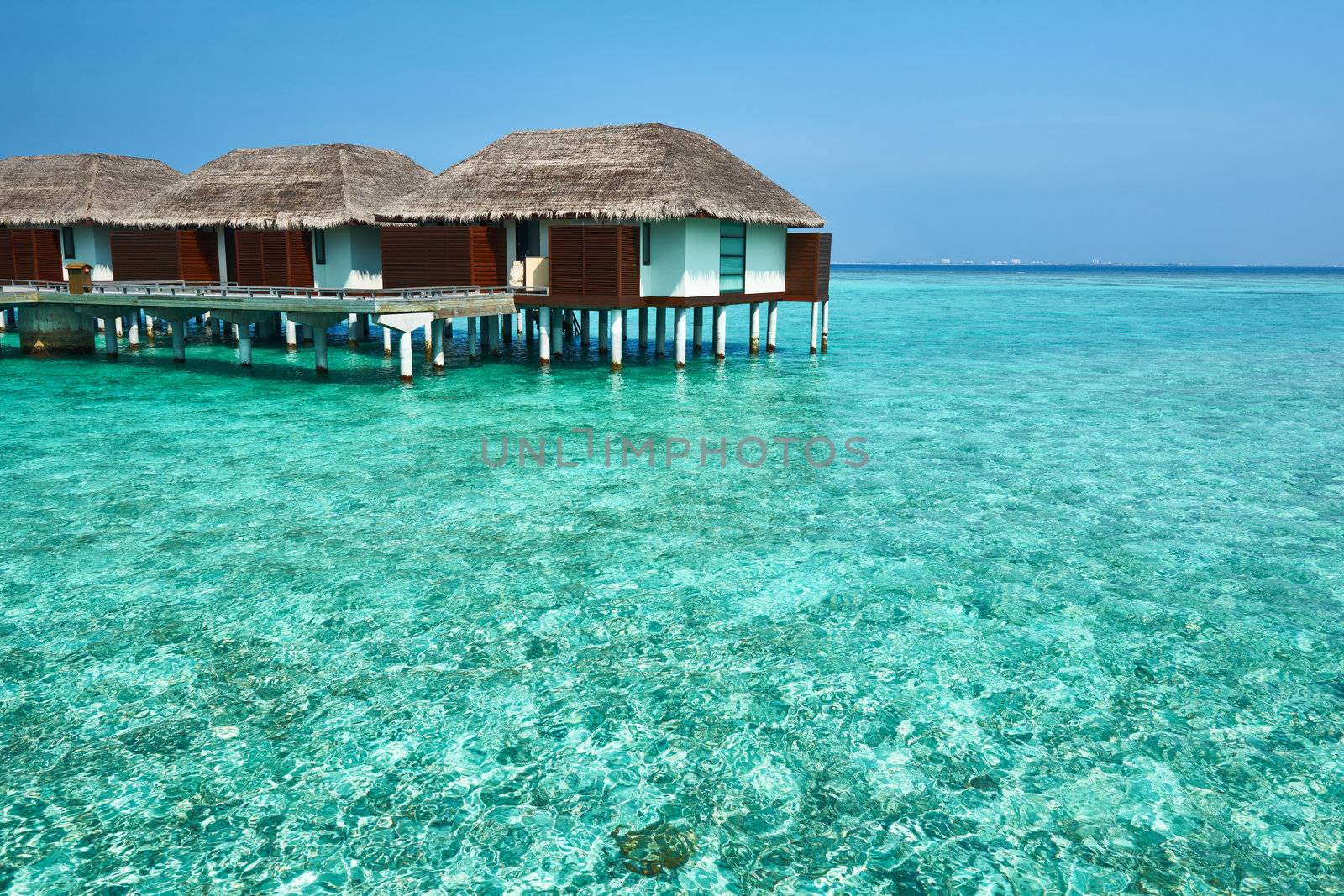 Beautiful beach with water bungalows at Maldives