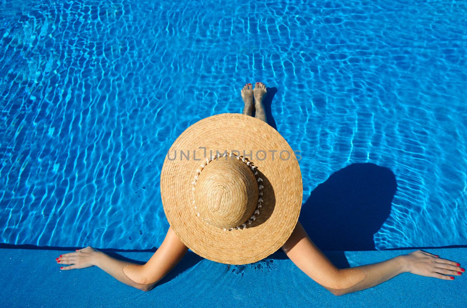 Woman at poolside by haveseen