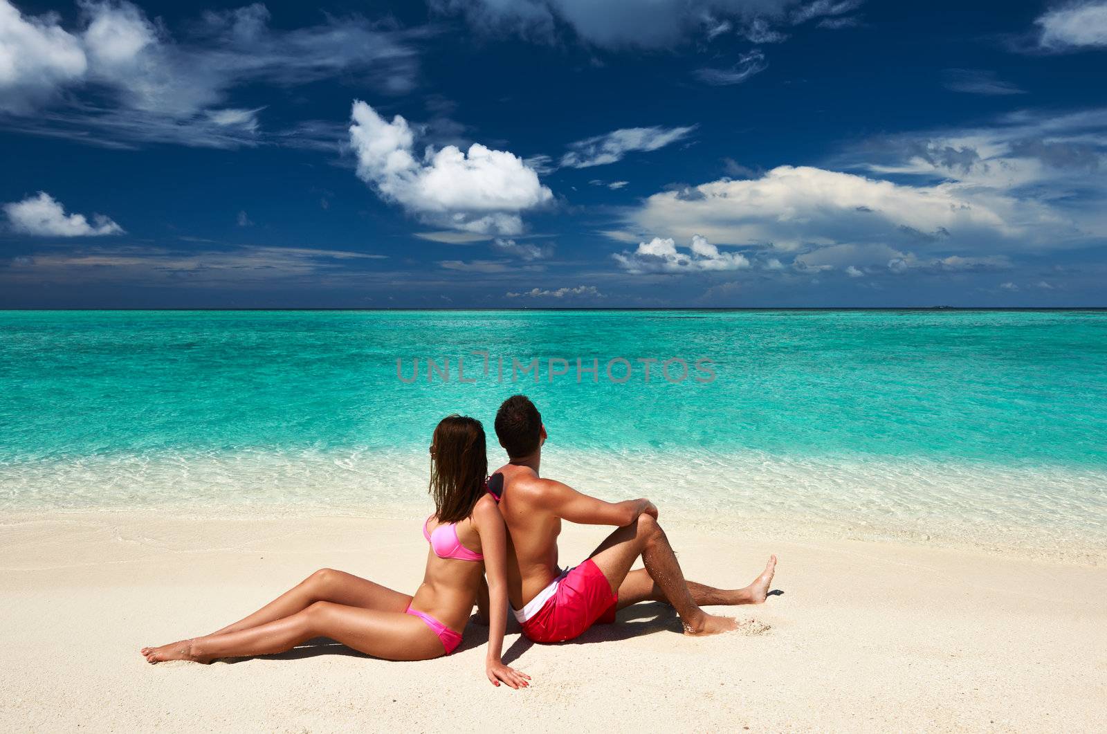 Couple on a tropical beach at Maldives