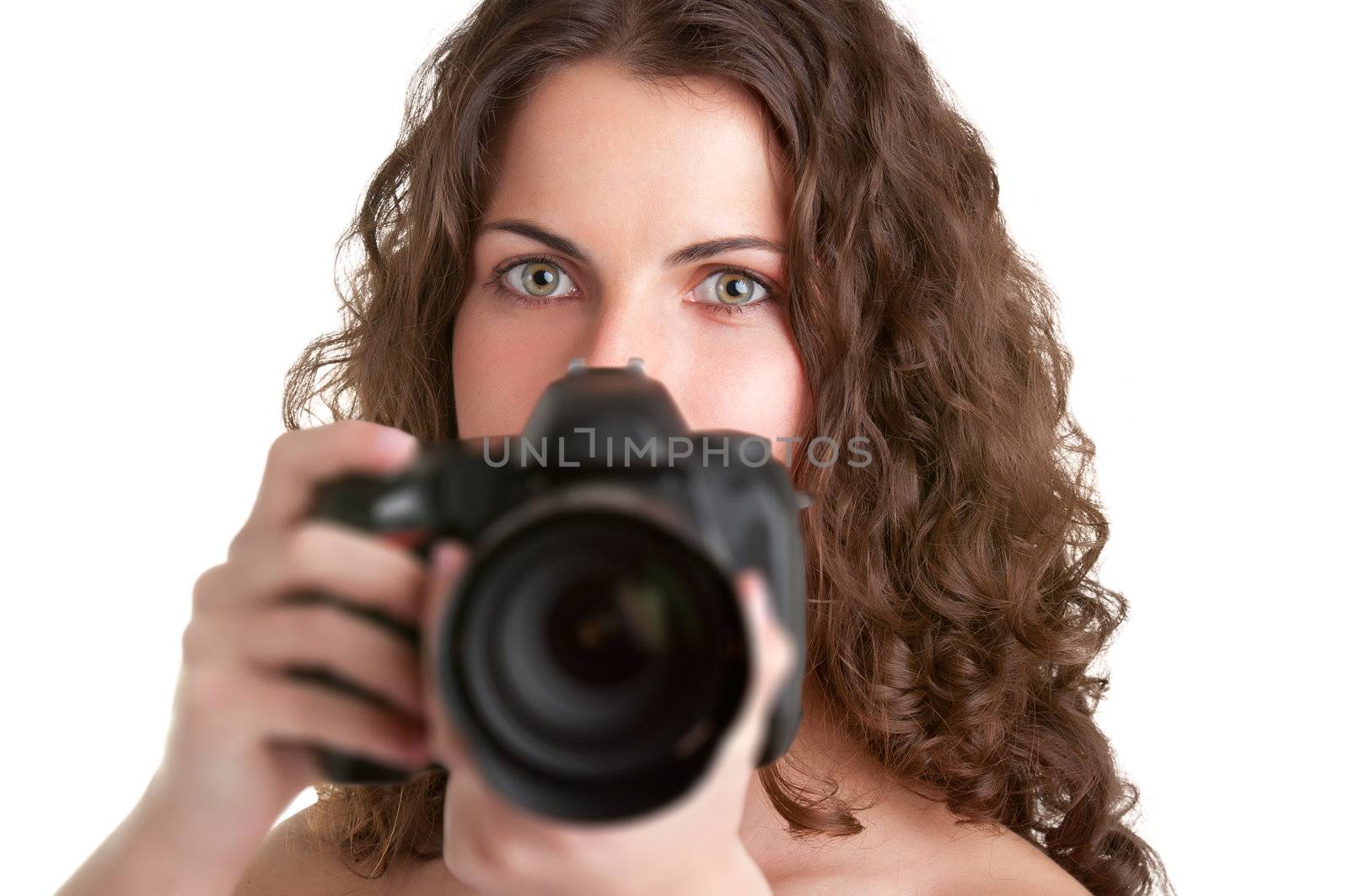 Woman holding an SLR camera, getting ready to take a picture, isolated in white