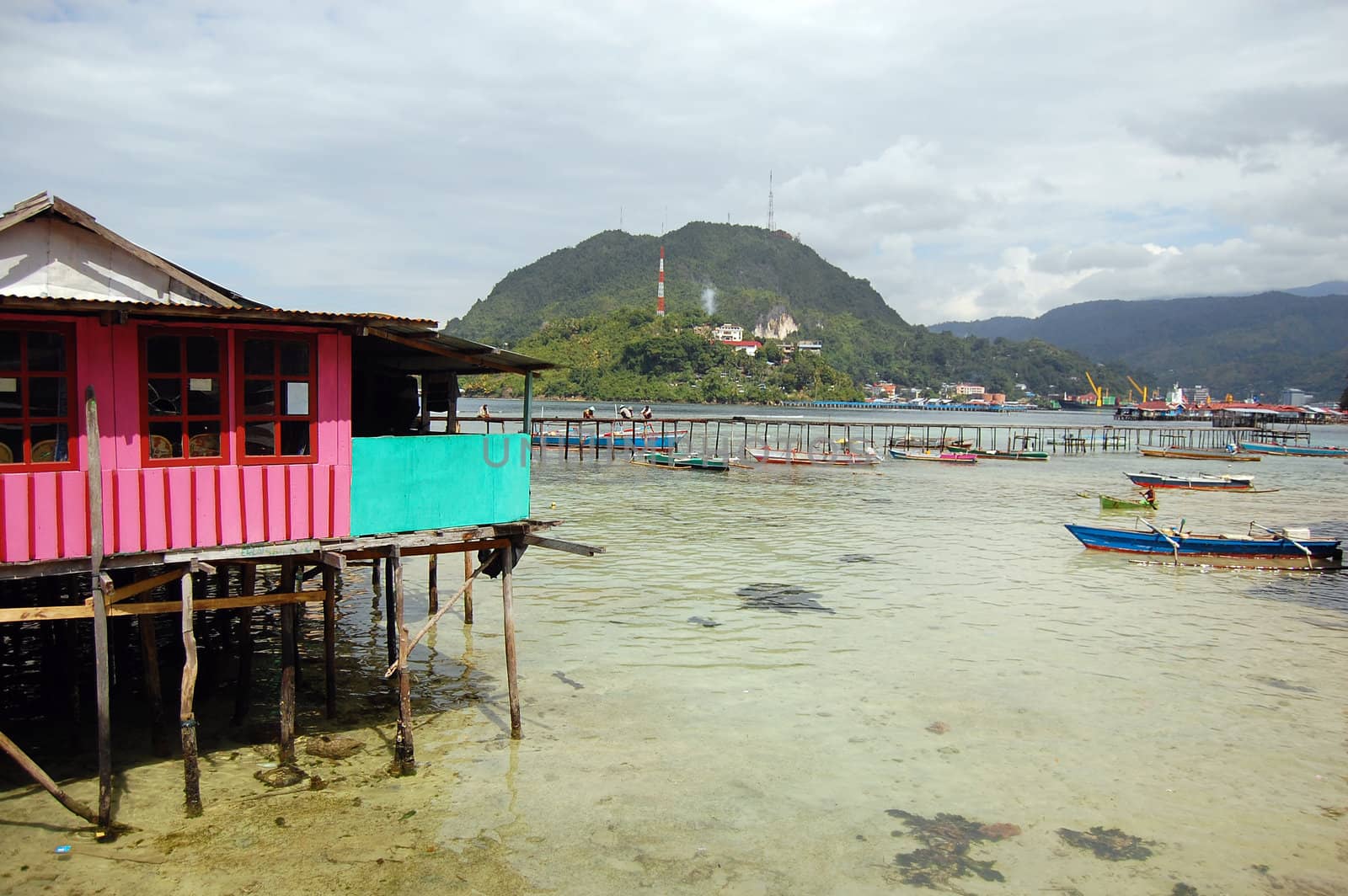 House and pier at sea coast, Jayapura, Indonesia