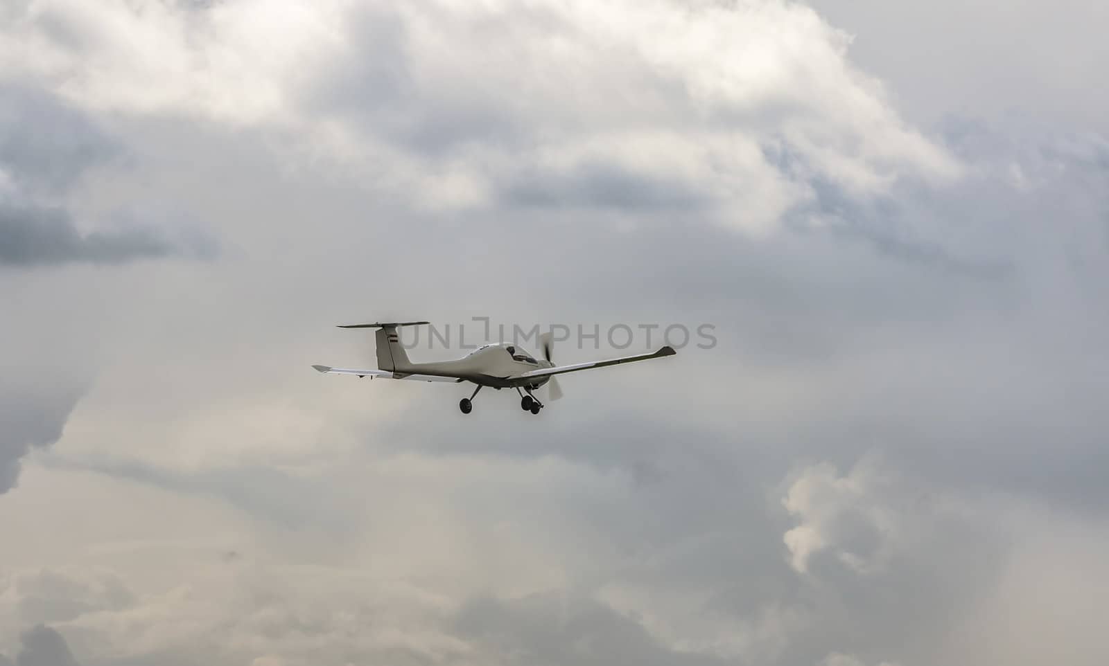 Plane flying in the cloudy sky