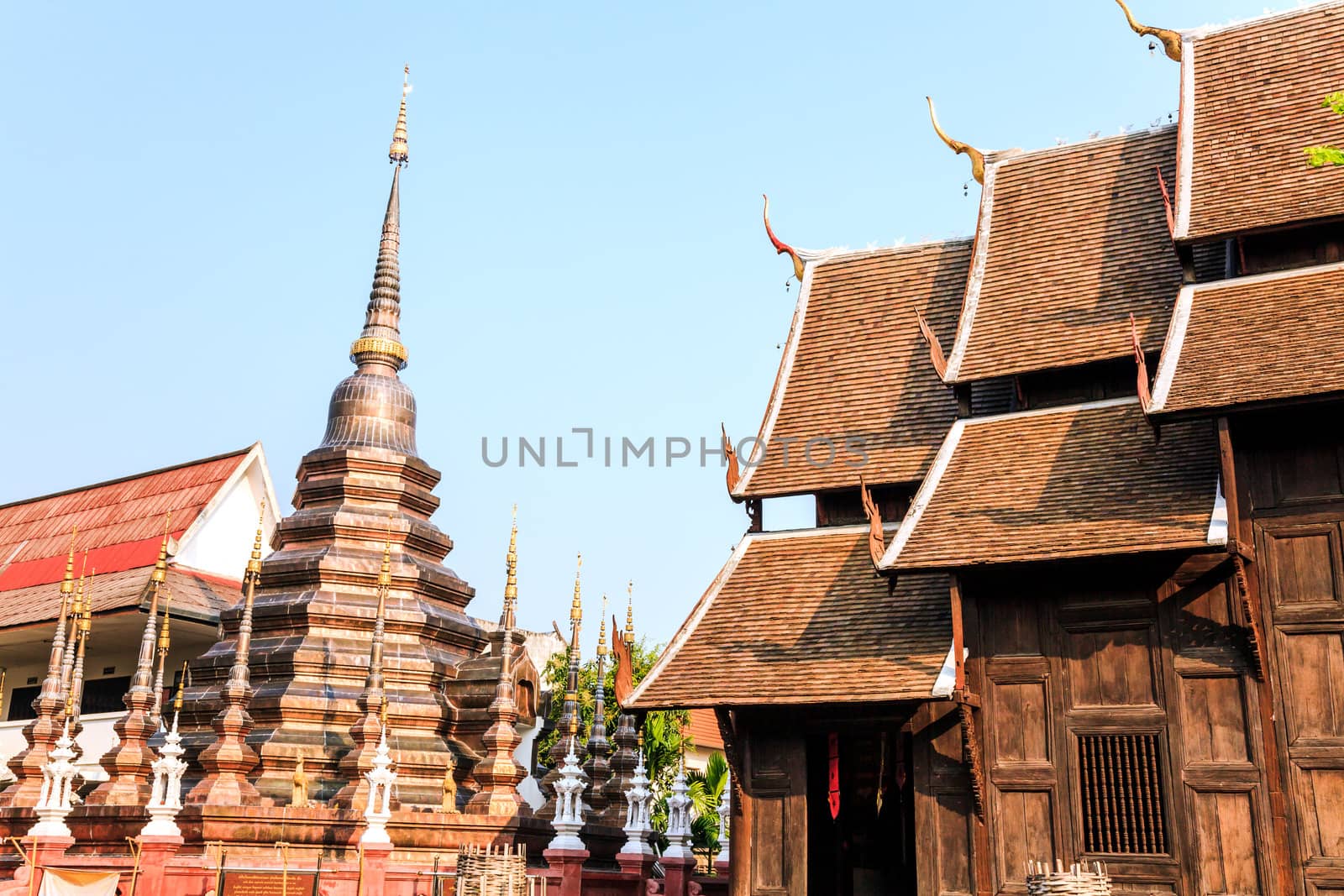 Bronz stupa in puntao temple, the very old wooden temple in chiang mai, thailand