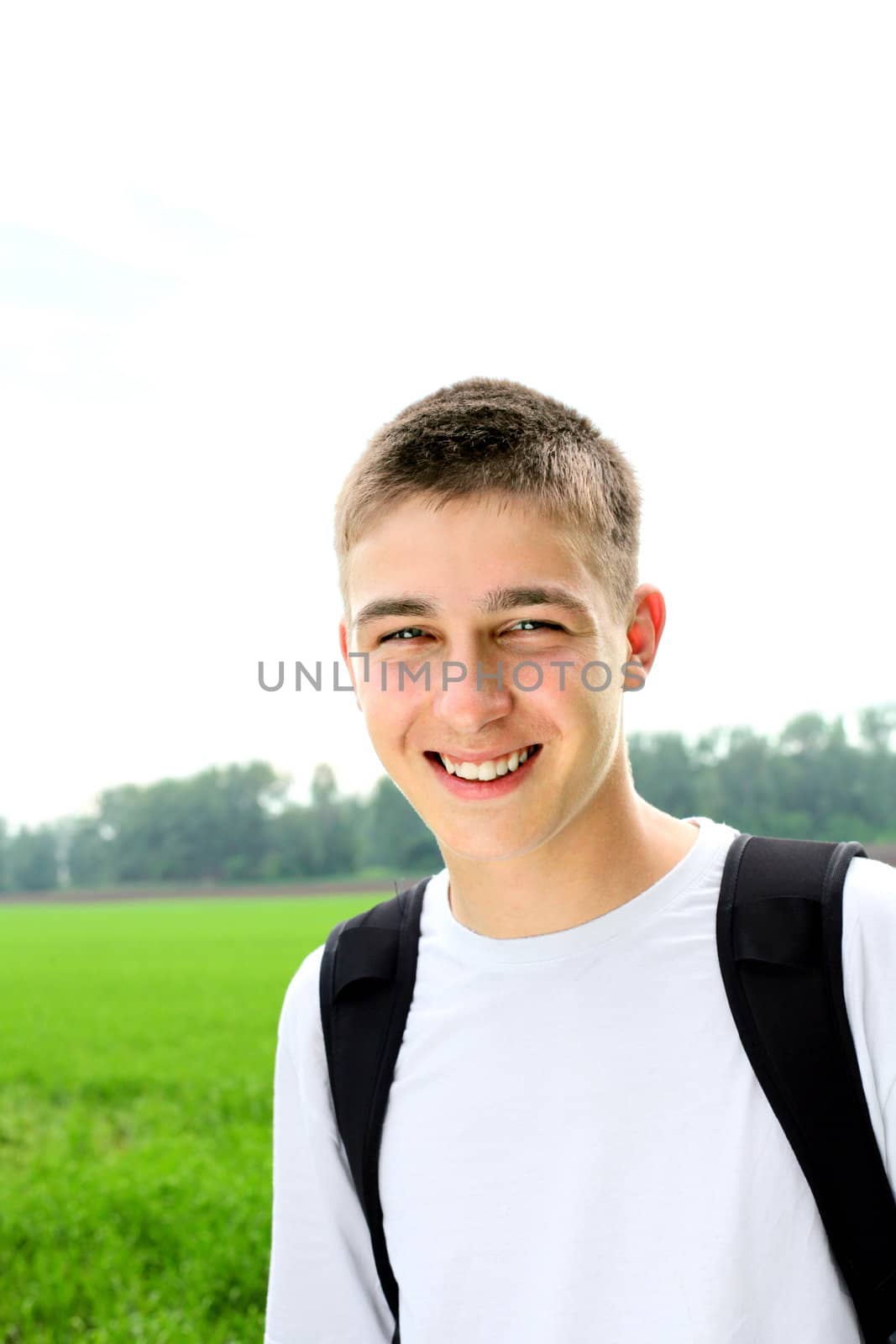 happy teenager portrait in the summer field