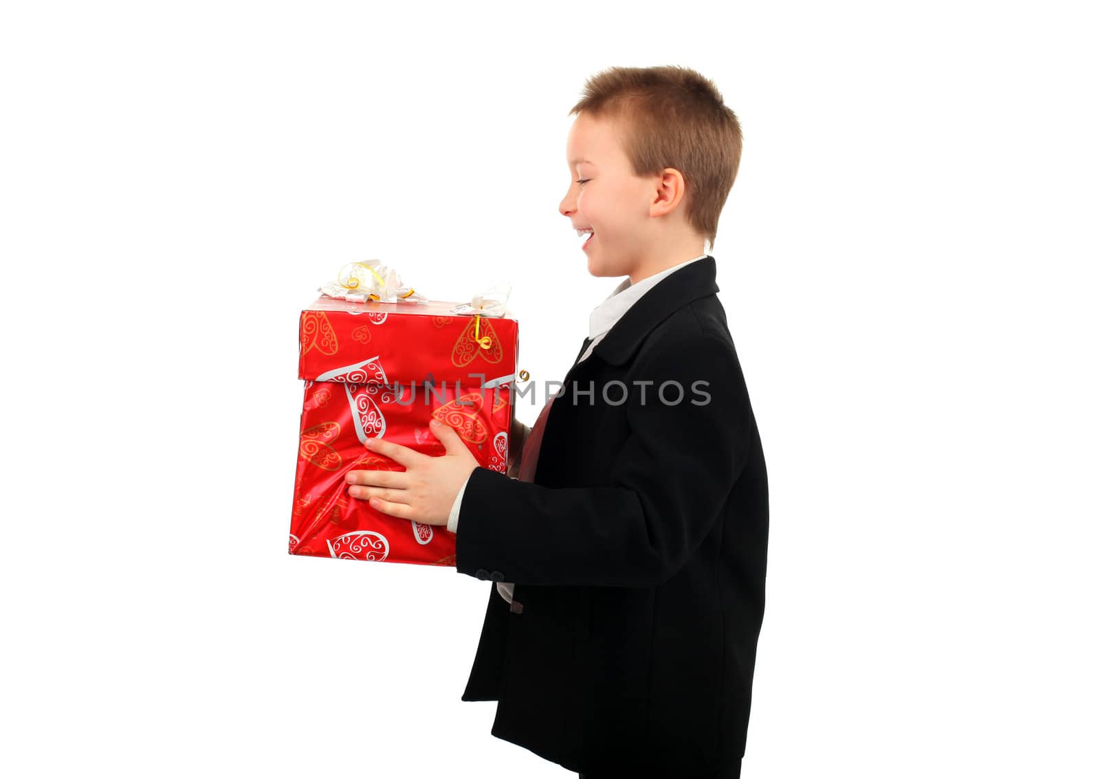 happy boy with a gift isolated on the white background