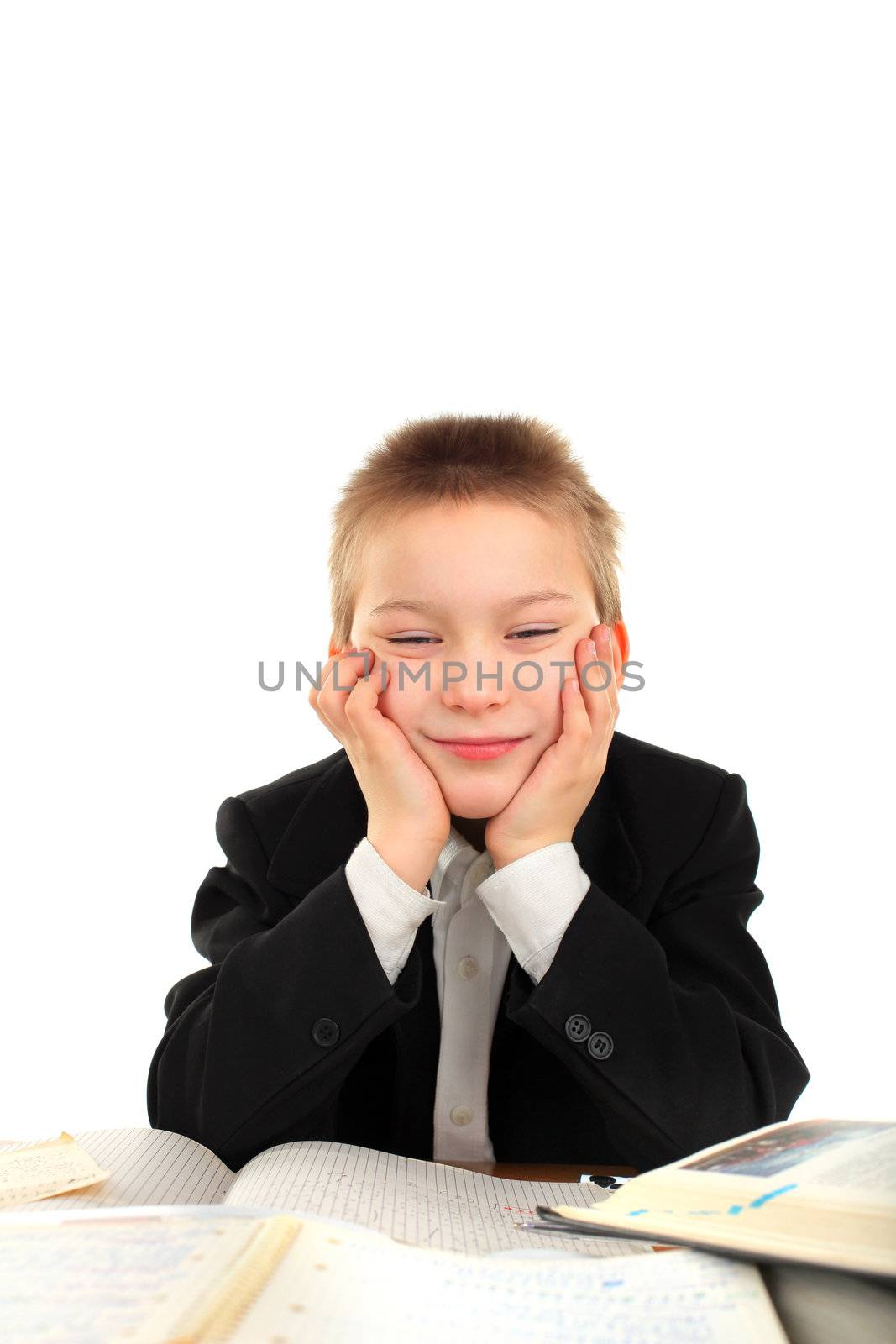 bored and tired schoolboy on the table