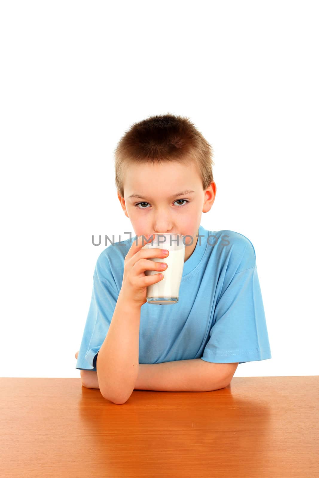 handsome blond boy with glass of milk isolated on the white background