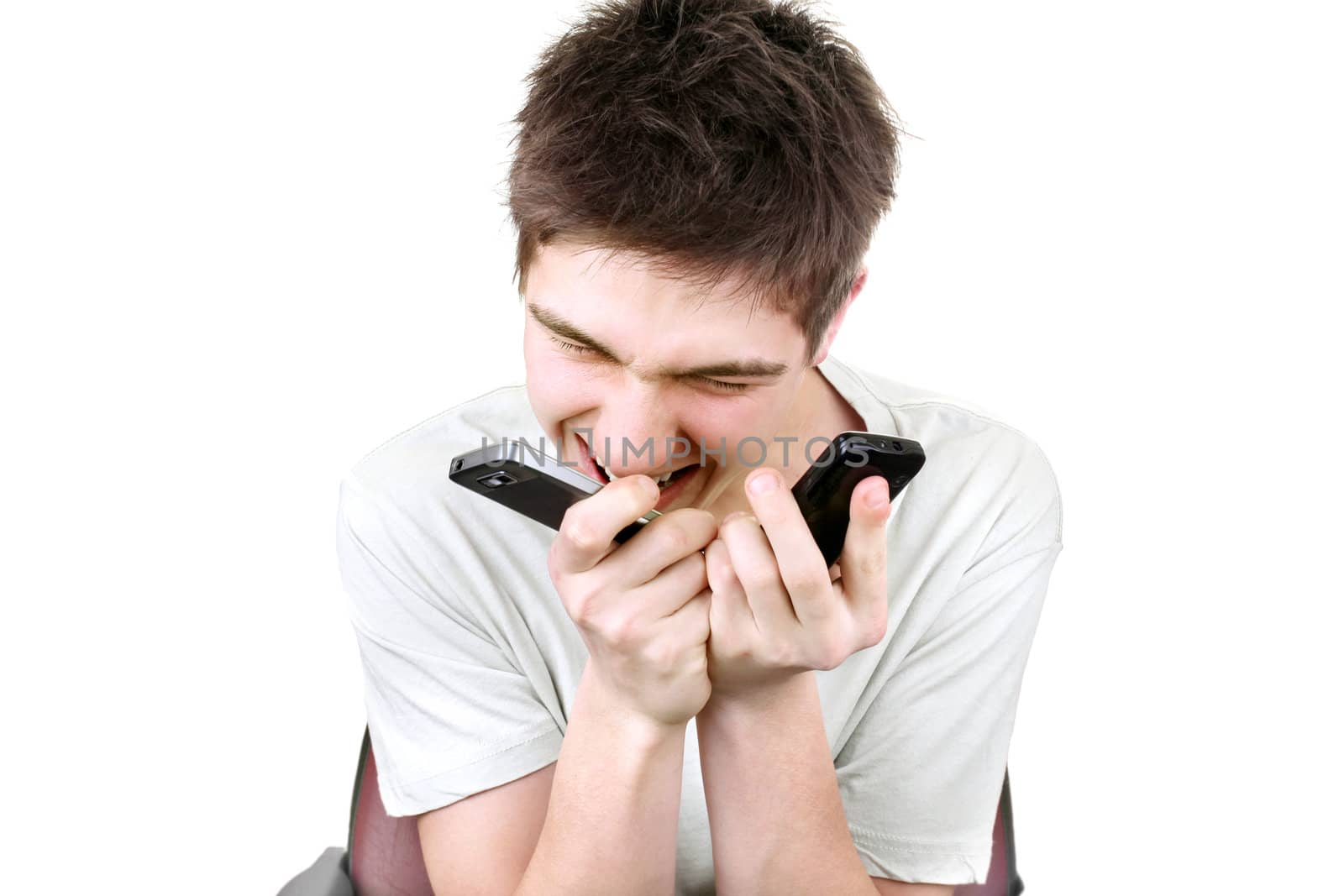 angry young man with two mobile phones