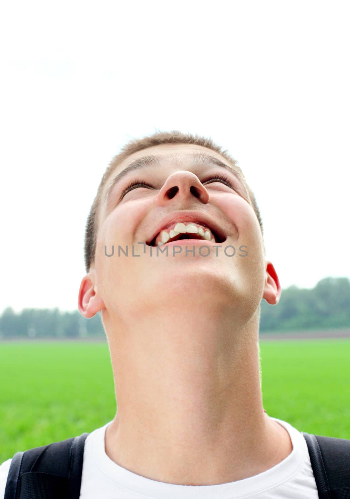 happy teenager portrait in the summer field