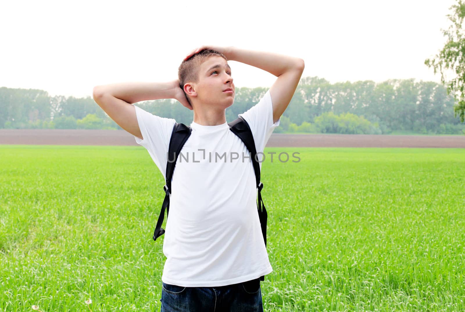 happy teenager in the summer field