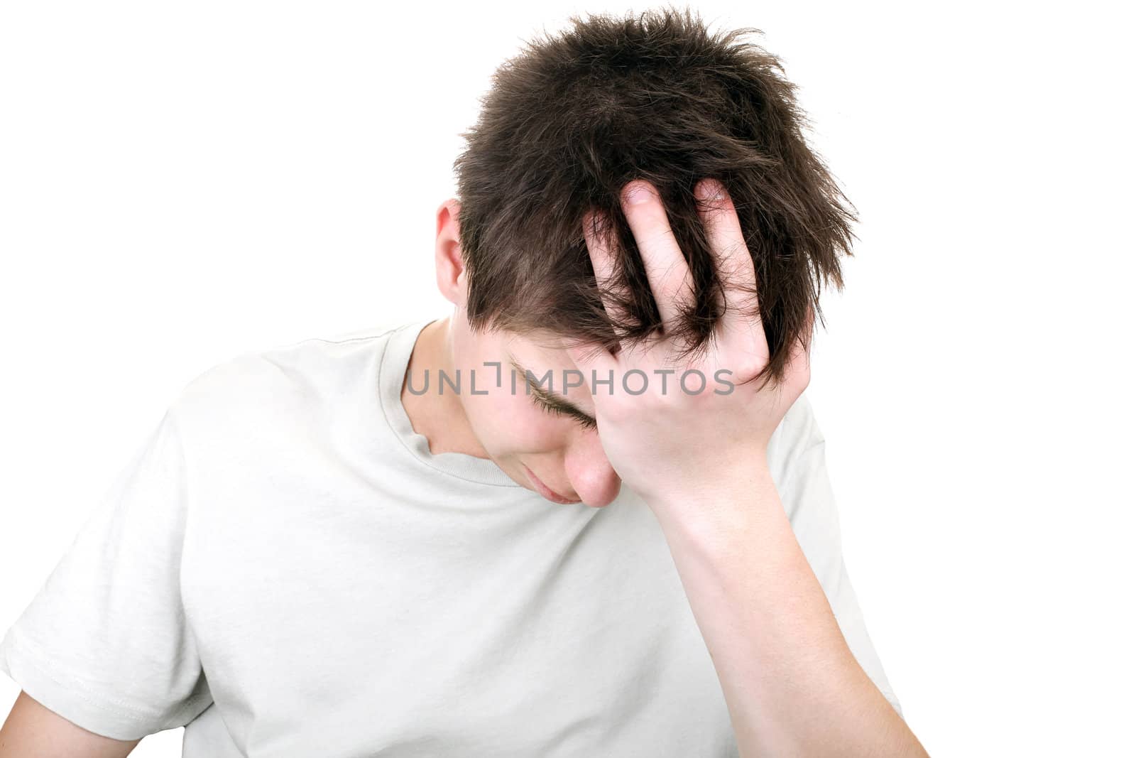 sorrowful young man portrait on the white background