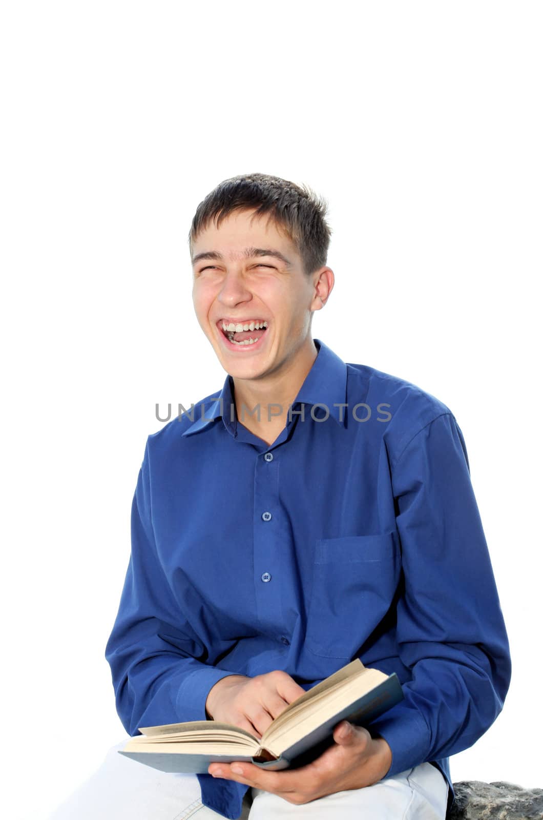 happy teenager sitting with a book on the stone. isolated on the white